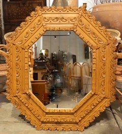 1970s Large Octagonal Mirror with a Baroque-style Carved Wooden Frame