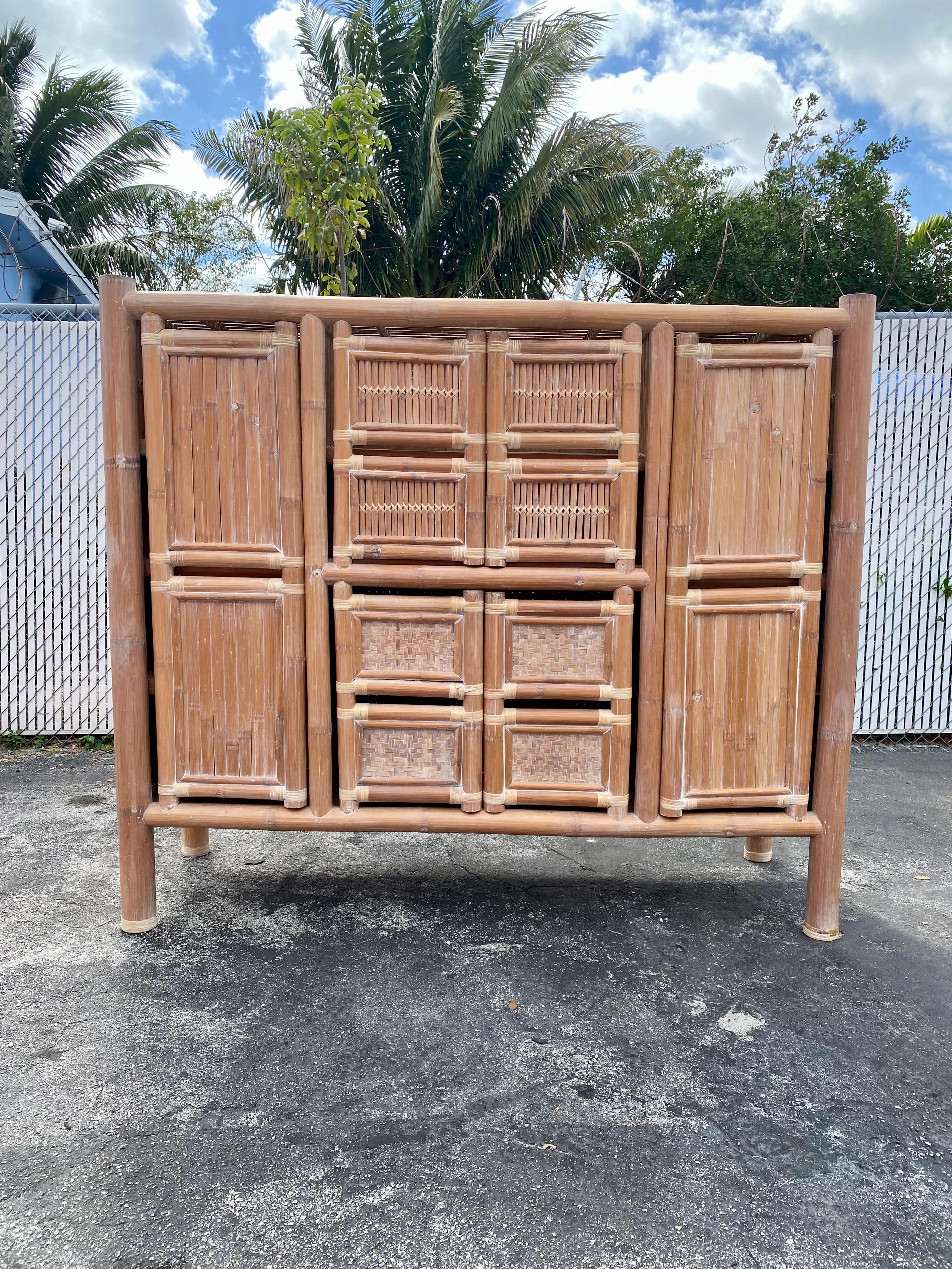 On offer on this occasion is one of the most stunning and rare rattan storage cabinet, tall sideboard you could hope to find. Outstanding design is exhibited throughout. The beautiful cabinet is statement piece and packed with personality!! Just