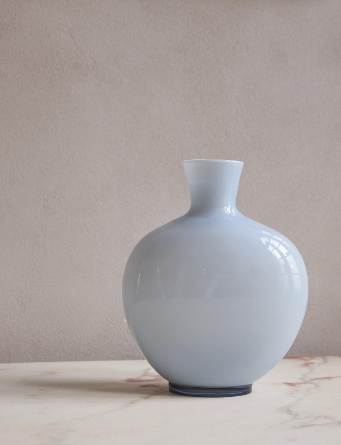 A large pale blue opaque Venini Vase hand-blown in Venice in the 1970s. The vase has an opaque white interior and a pale blue transparent surround. An elegant and refined addition to any Murano glass collection.