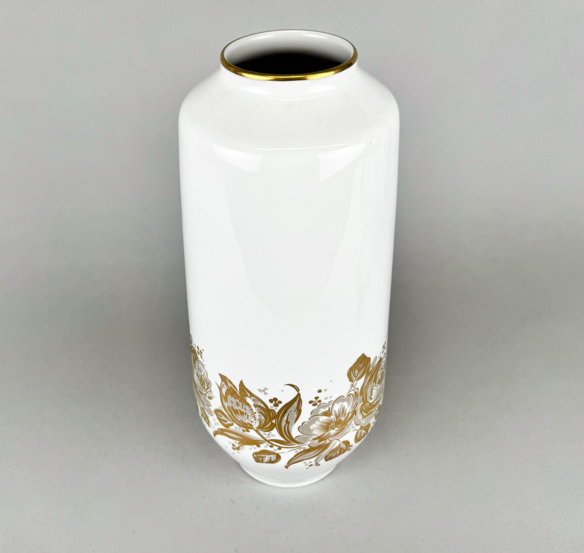 Tall white porcelain vase with golden decor by Hutschenreuther. Made in Germany in the 1970's.
