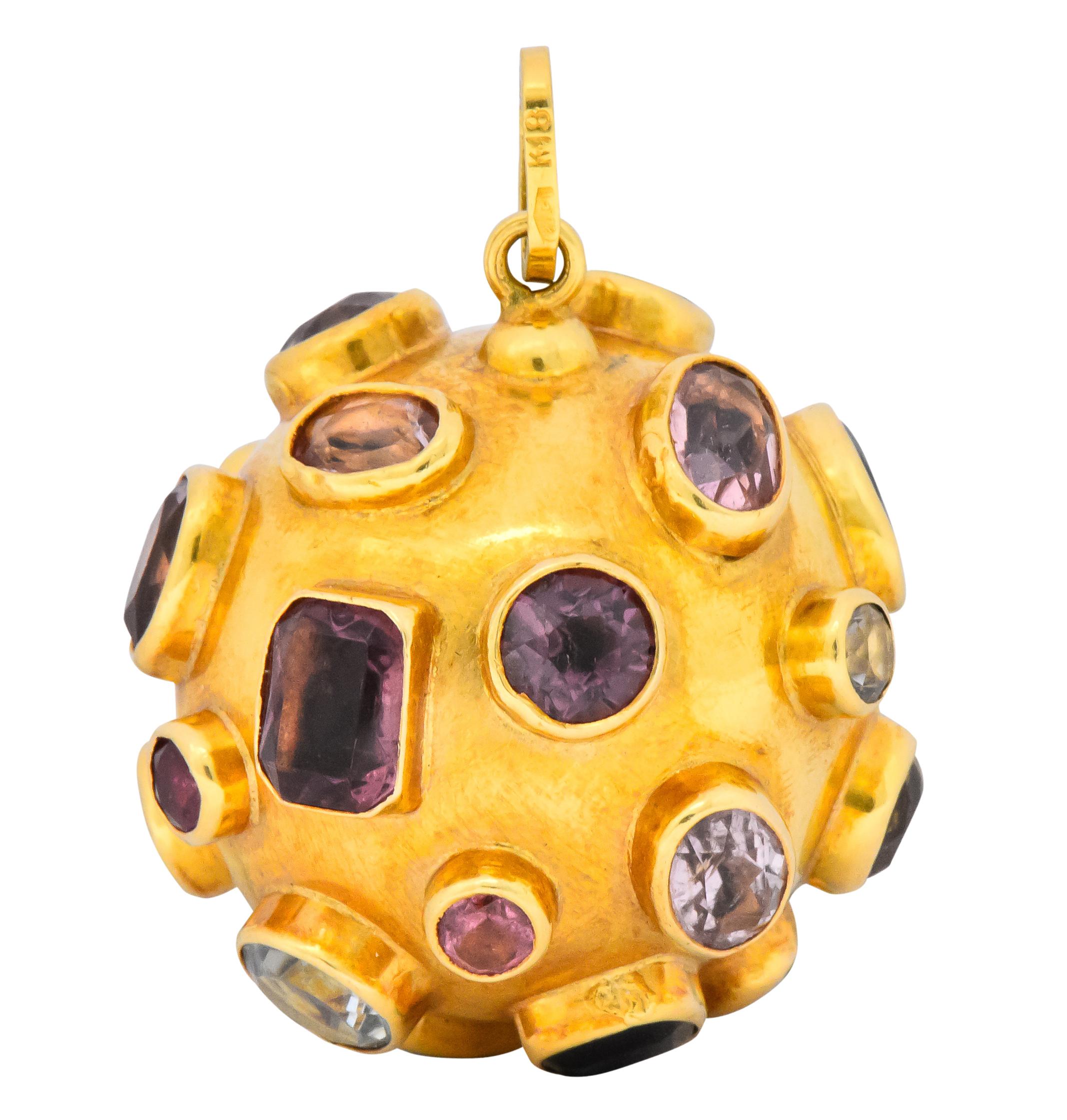 Designed as a hollow polished gold sphere with bezel set gemstones throughout

Including amethyst, citrine, tourmaline, topaz, sapphire, aquamarine and tanzanite

Of varying cuts, shapes and colors

Stamped 18K

Diameter: Approx. 1 1/4 Inches

Total