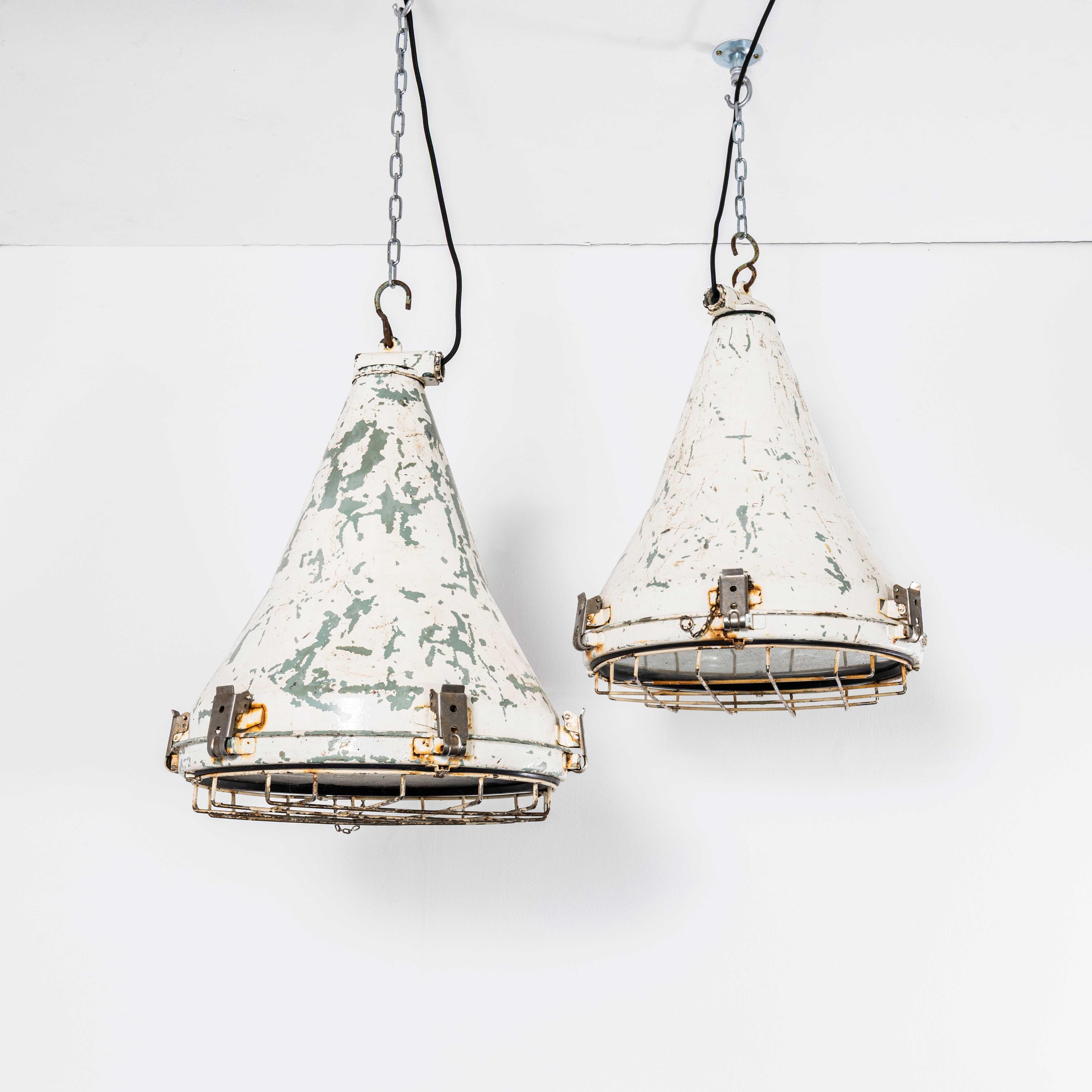1970’s Large Scale Nautical Ships Lamps – Pair. 
Sadly we don’t know the manufacturer, the lamps are made from heavy cast aluminium with glass lamp covers and protective grills. The lamps have been cleaned, but we left the history and character. All