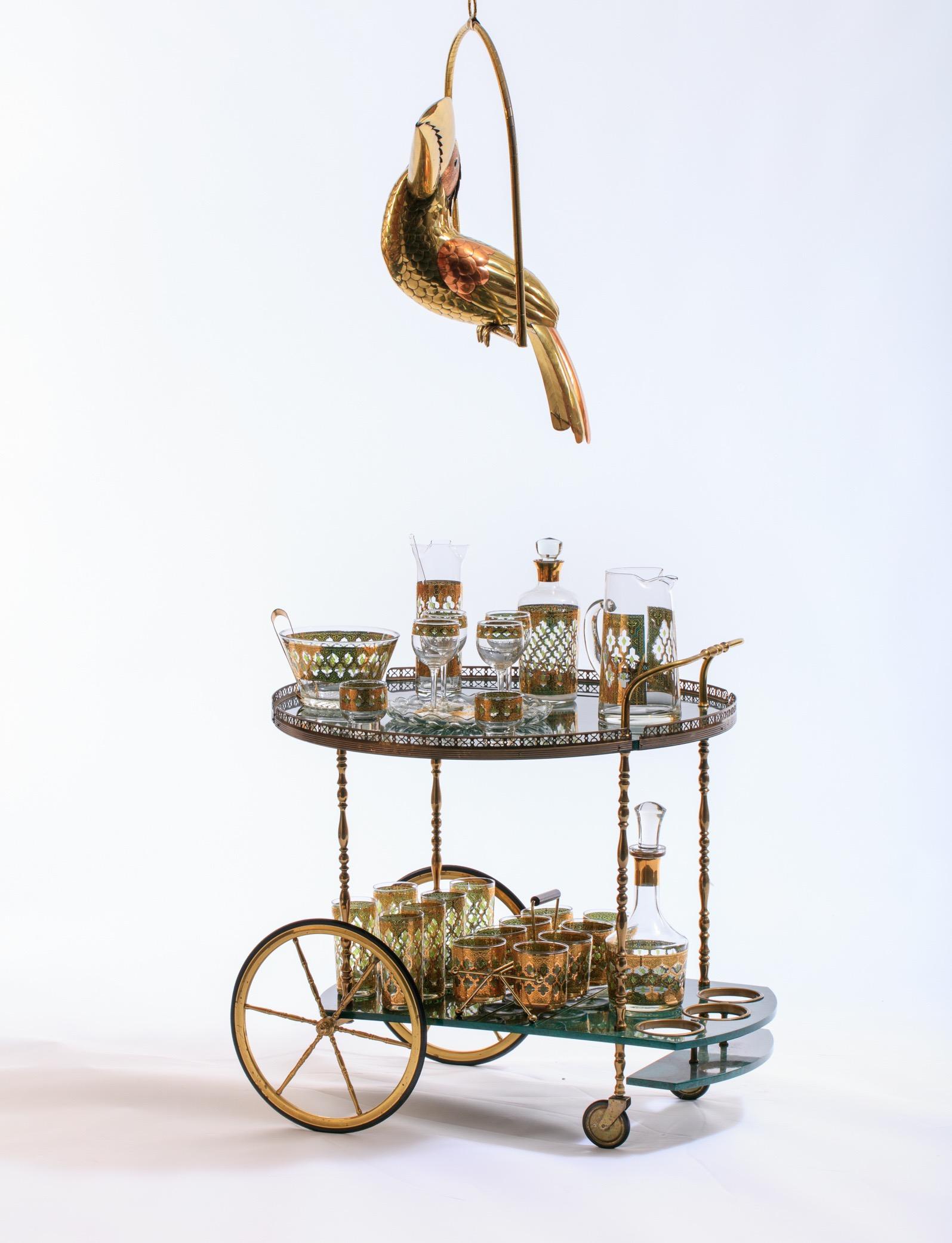 Large, life-size brass and copper Sergio Bustamante toucan on a hanging perch. Bustamante's work was most recently featured by Architectural Digest in its September 2019, where rock star and interior designer extraordinaire chose a Bustamente