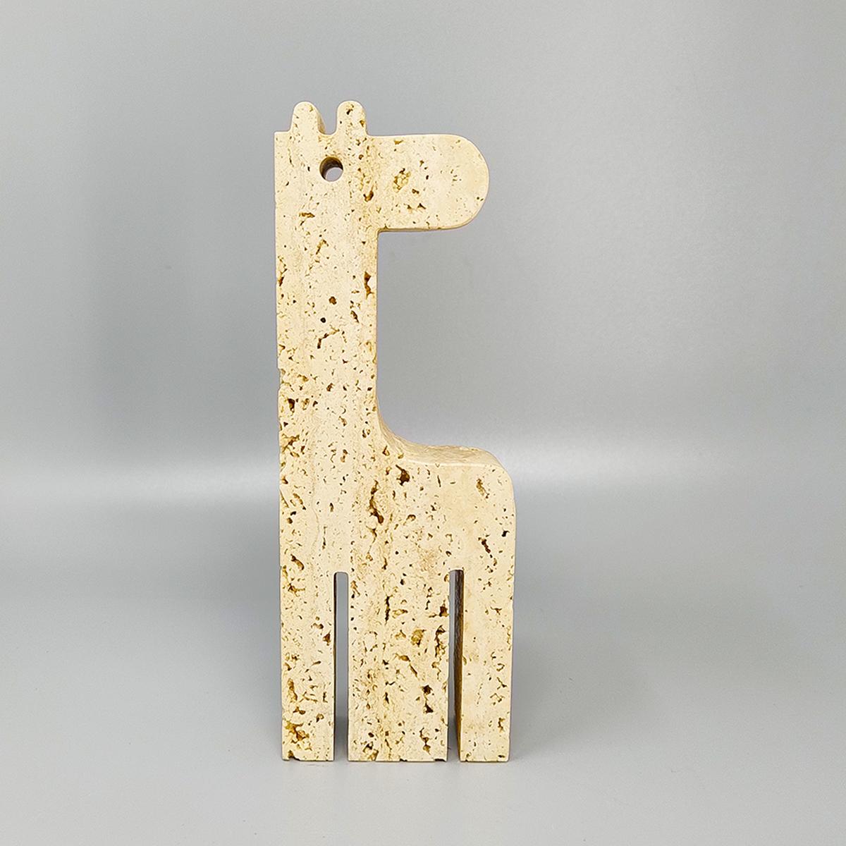 1970s Original large  travertine giraffe sculpture by Enzo mari for F.lli Mannelli. The item is in excellent condition. Made in Italy.
Dimension:
2,75 w x 1,18 D x 7,87 H inches
L 7 cm x P 3 cm x cm 20 H.