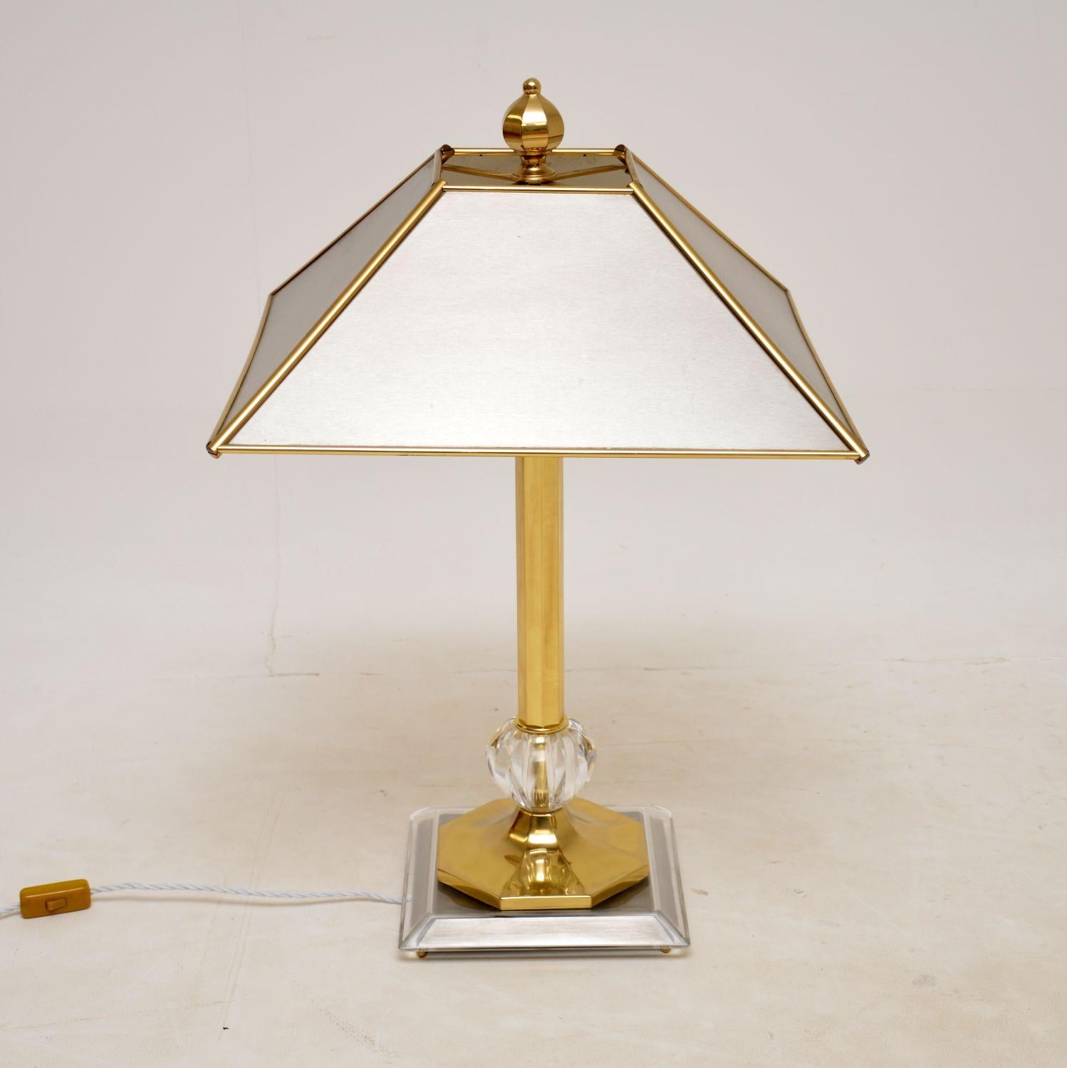 A very large and extremely impressive vintage table lamp in brass, steel and glass. This was recently imported from Italy, it dates from the 1970’s.

The quality is outstanding, this is very heavy and very well made. The large brushed steel shade is