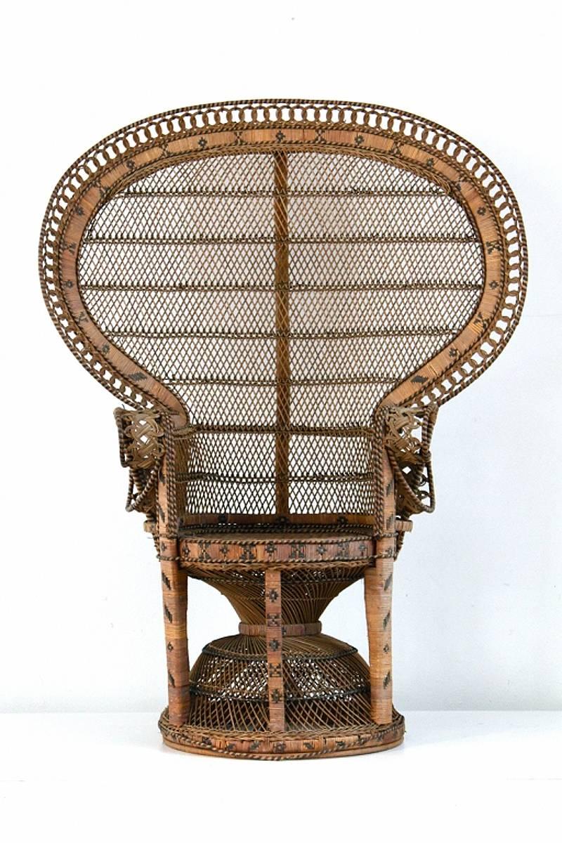 Original peacock chair in rattan, known as the Emmanuelle chair, circa 1970.