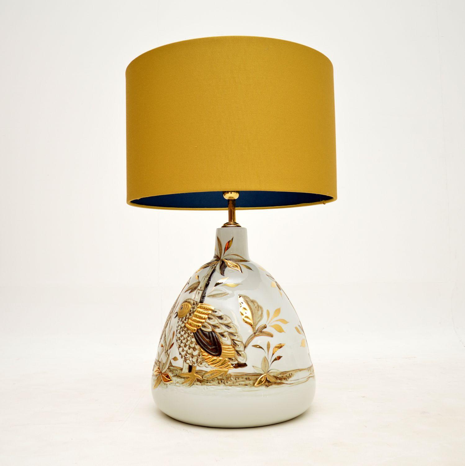An absolutely gorgeous vintage Italian Capodimonte ceramic table lamp. this was made in Italy, it dates from the 1970-80’s.

It is a large and impressive size, it is beautifully hand painted and artist signed. The gold, cream and brown tones are