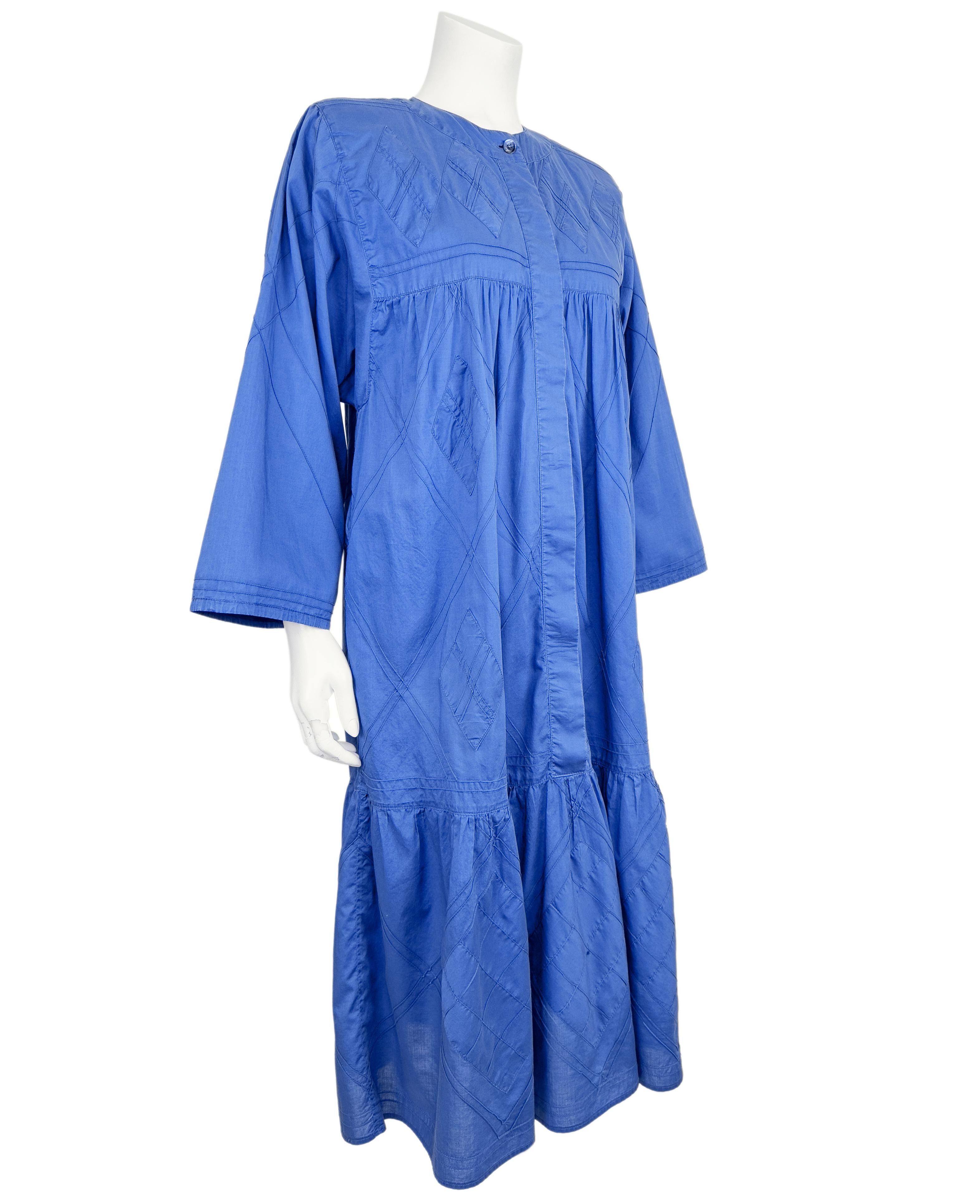 Effortlessly chic and endlessly comfortable, this 1970's Laura Biagiotti smock dress is a timeless expression of relaxed elegance. Crafted from breathable cotton in a rich cobalt blue, the dress features subtle diamond quilting that adds texture and