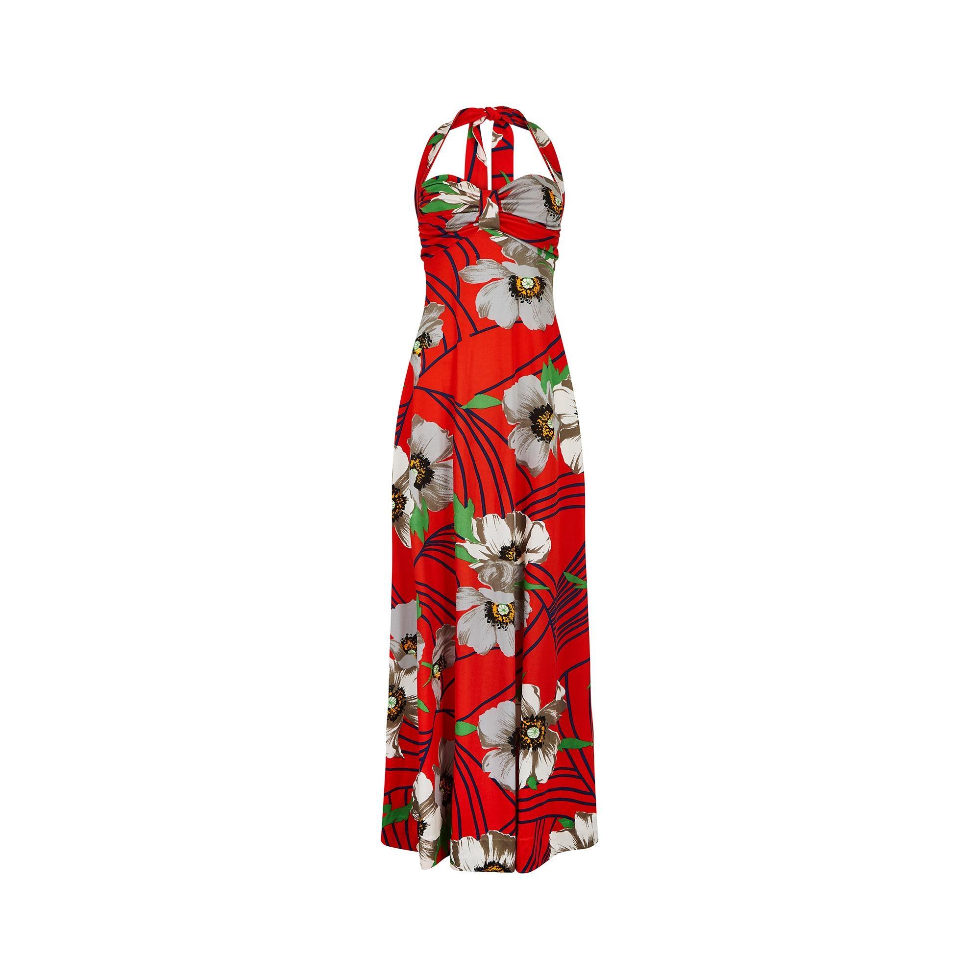 Glamorous vintage Cote d'Azur resort wear by Laurent Servet.  The ankle length dress is a bright red featuring a striking floral pattern of white, navy, green and yellow poppies.  It really encapsulates that summer by the pool feeling and dates to