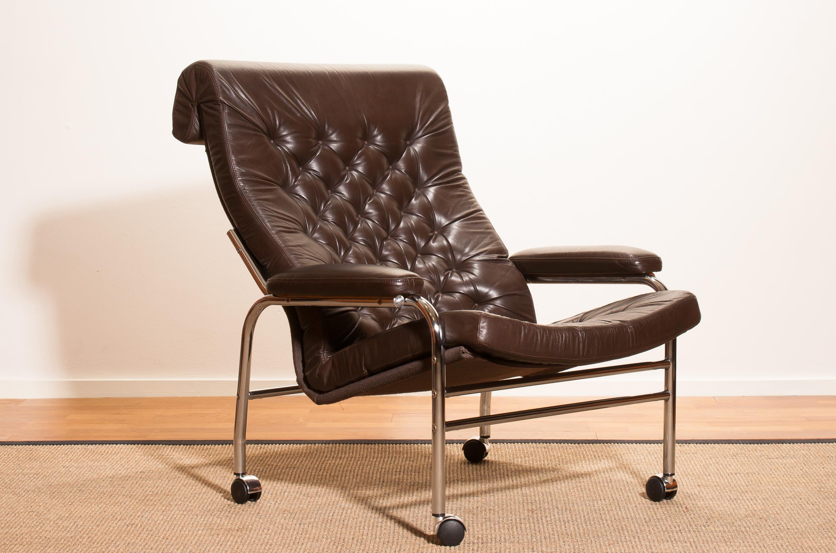 Beautiful and rare lounge chair designed by Noboru Nakamura, Sweden.
This chair has a dark brown leather seating on a chromed tubular wheeled frame.
It is in a mint condition,
circa 1970s
Dimensions: H 90 cm, W 78 cm, D 93 cm, SH 40 cm.