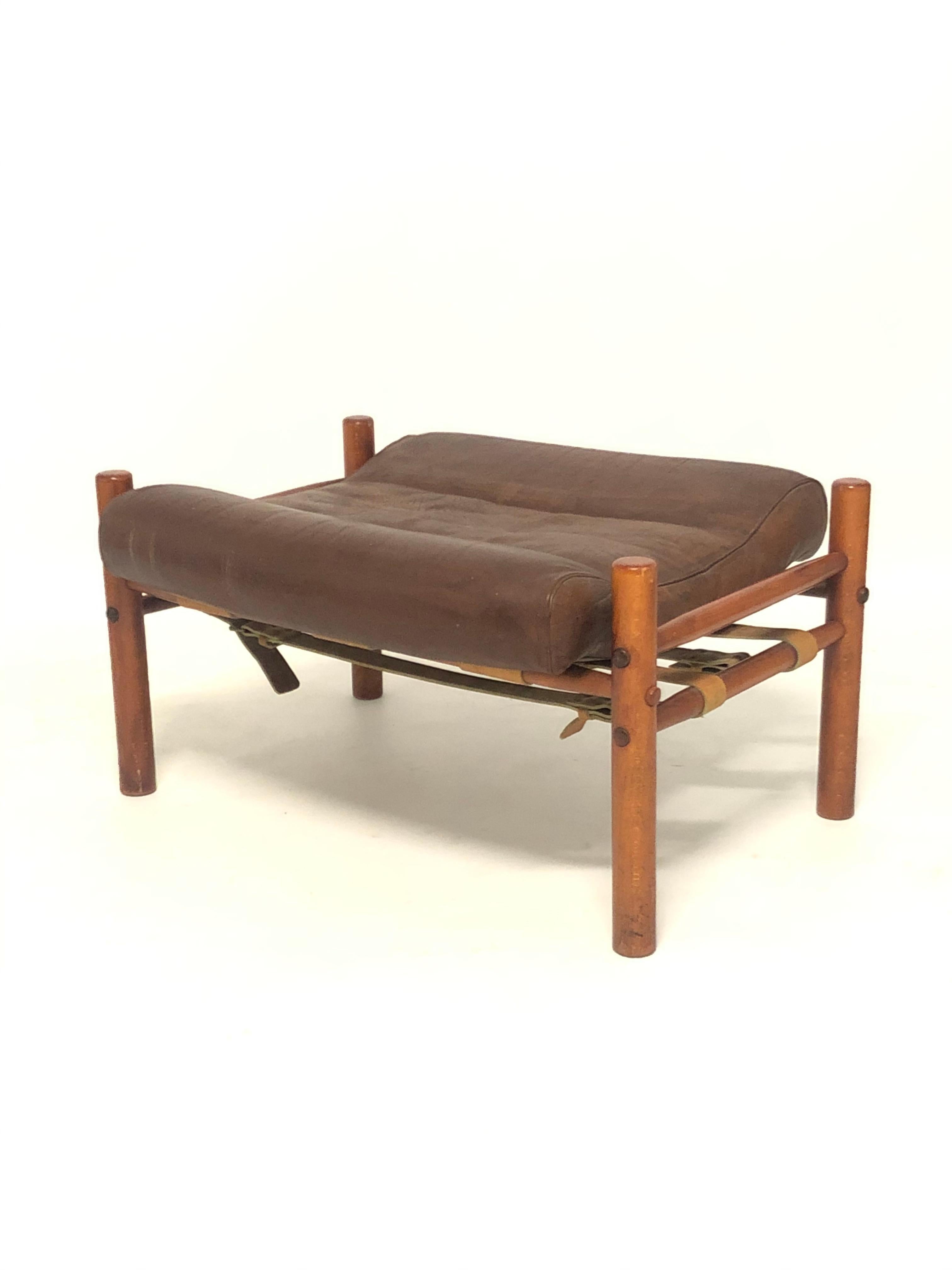 An original 1970s production footstool ottoman. In stained beech and teak wood with chocolate brown leather seat. These stools work with both Inca and Kontiki model chairs or as a stand alone stool.

In good original condition. The frame is solid