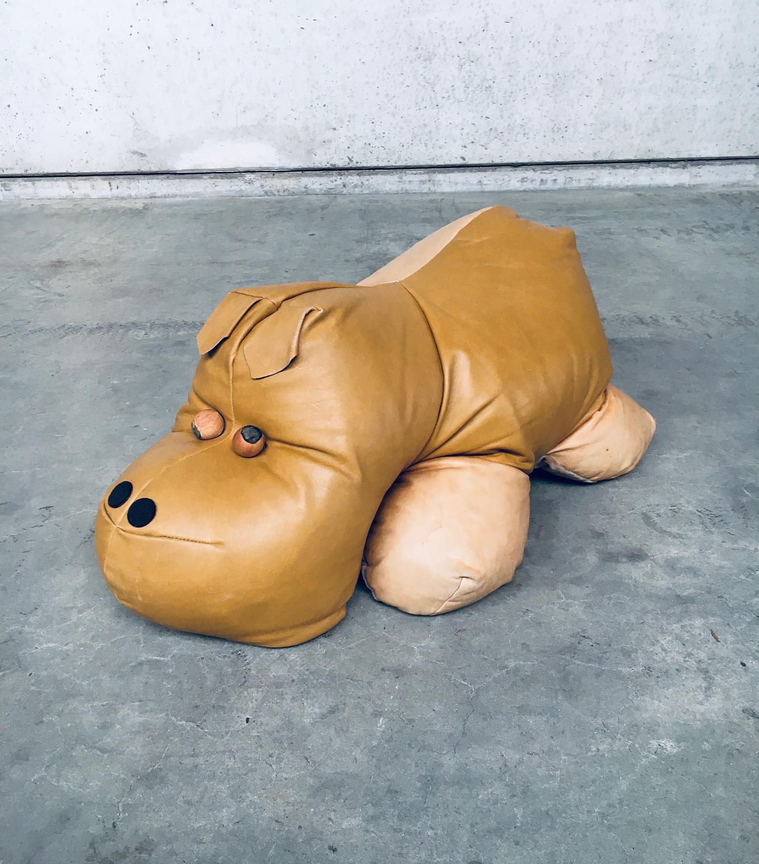 Vintage Leather Hippo Hippopotamus Footstool Pouf. Made in the 1970's, probably Italy. Two tone leather large pouf or foorstool with soft fabric on the underside and pair of wooden ball eyes. There's a patch repair on the underside of the hippo and