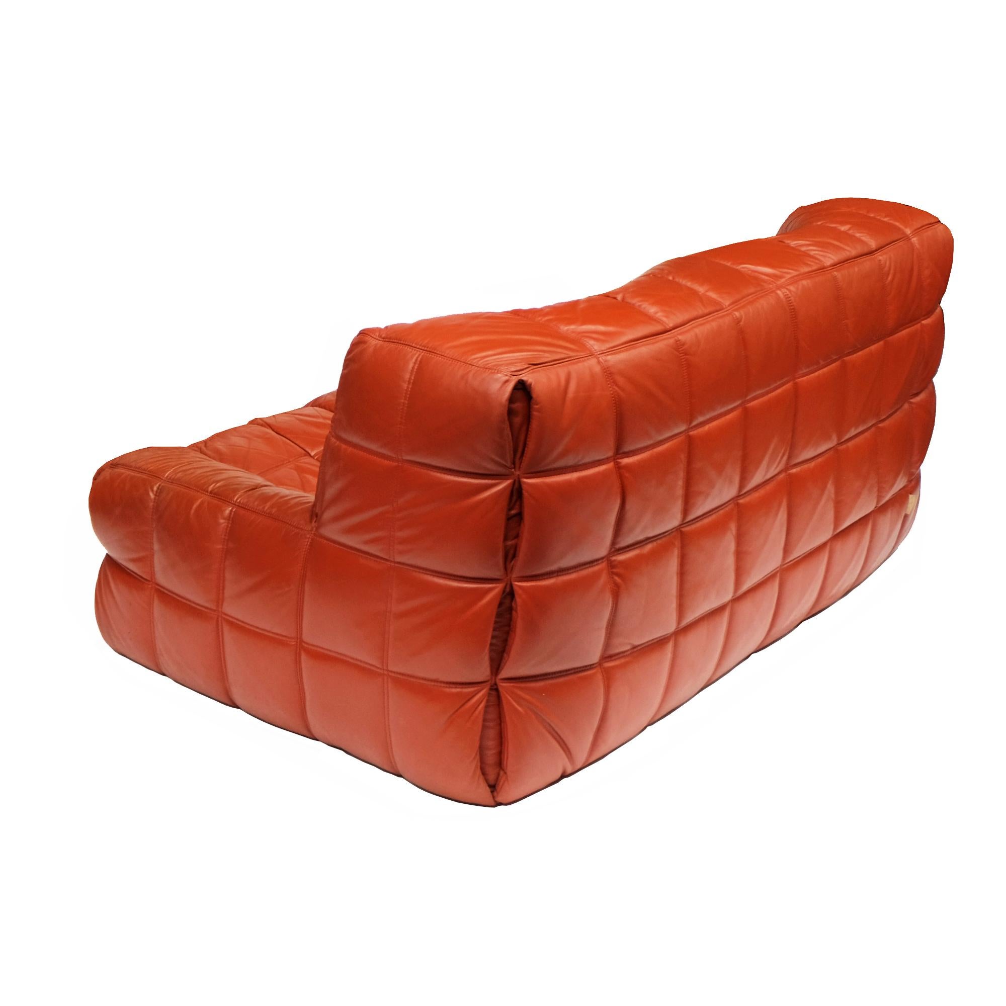 Two-seat sofa designed by Michel Ducaroy for Ligne Roset, 1976.

Foam seating elements upholstered in stitched leather.

Ligne Roset labels.

Measures: Sofa H 75cm x W 160cm x D 100cm.
 