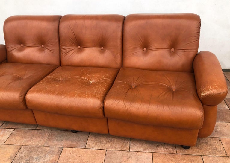 1970s Leather brown sofa and two armchairs vintage light used, original from Lucca Tuscany.
Size cm: 
L 95 armchair; 215 sofa
H 80
P 100.
Comes from an old country house in the Garfagnana area of Tuscany.
As shown in the photographs and videos,
