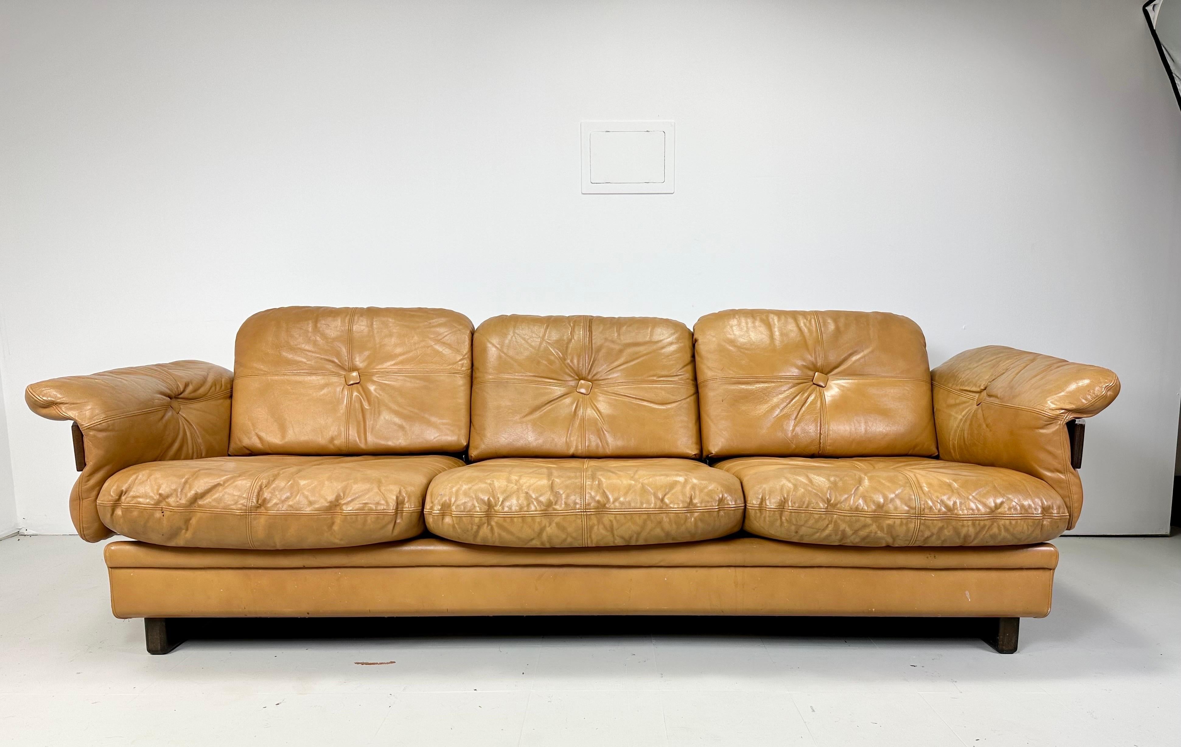 1970’s Leather Sofa. Bentwood arms with brass details. Button Cushions. Soft light Butterscotch color vintage leather. Sofa sits low and deep for lounging comfort. Matching settee available

Delivery to NYC area for $475