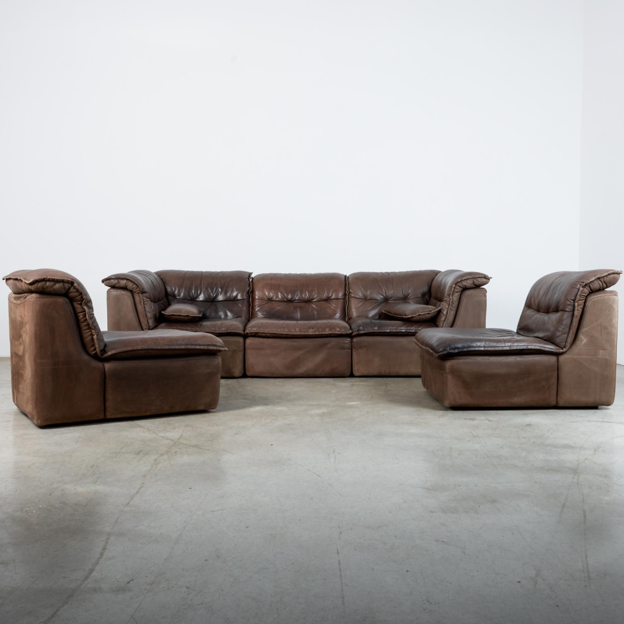 From Germany, circa 1970 this leather sofa set includes two corner units and three standard modules. Simple shape give a sleek impression with a comfortable and natural finish. Great aged patina and upholstery style with thick seam and tufted