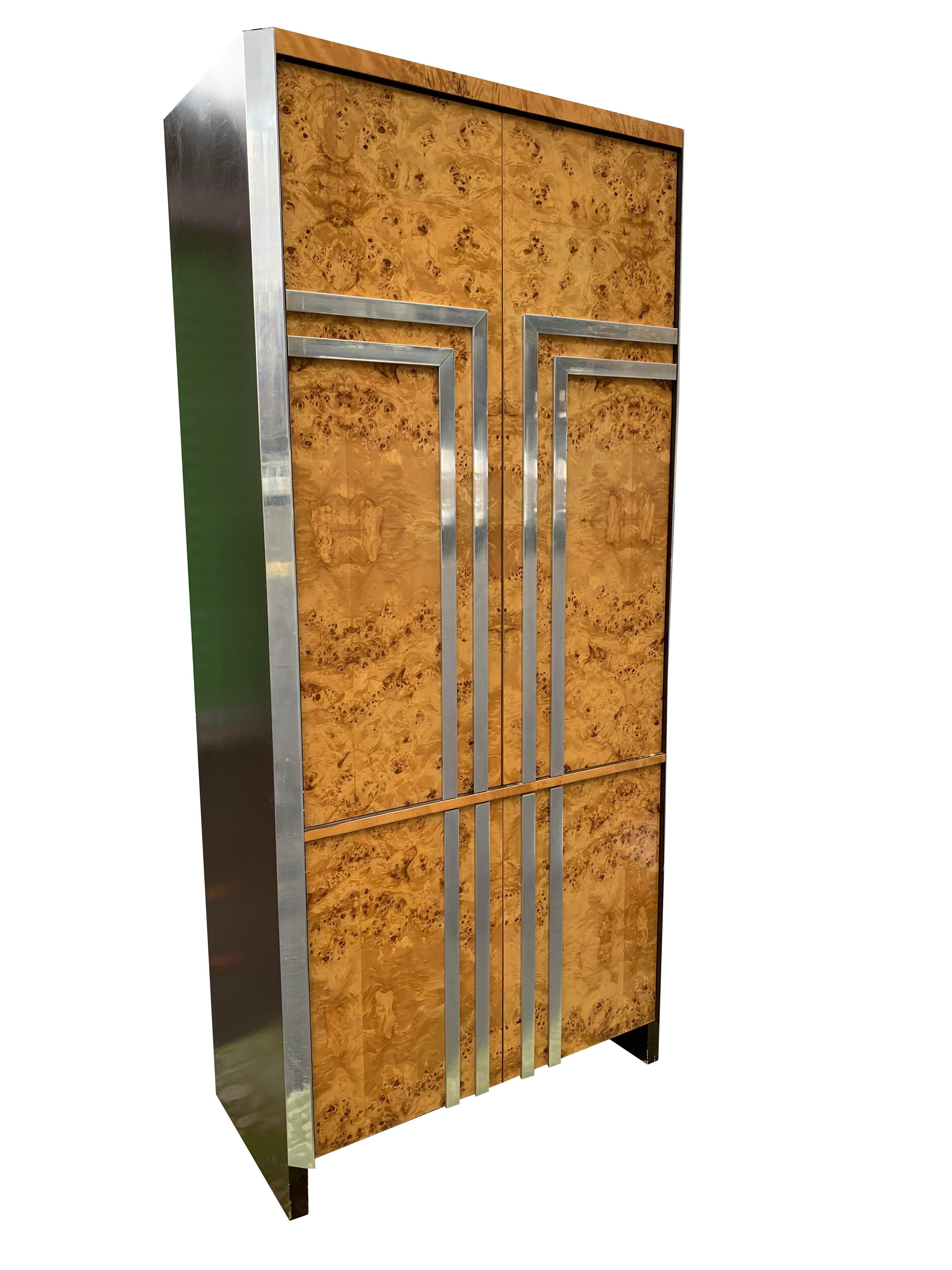 Vintage Leon Rosen for Pace Burl Wood and Chrome Armoire Cabinet

This vintage armoire cabinet is a must-have for anyone looking to add a touch of retro style and elegance to their home. The unique design and high-quality materials make it a