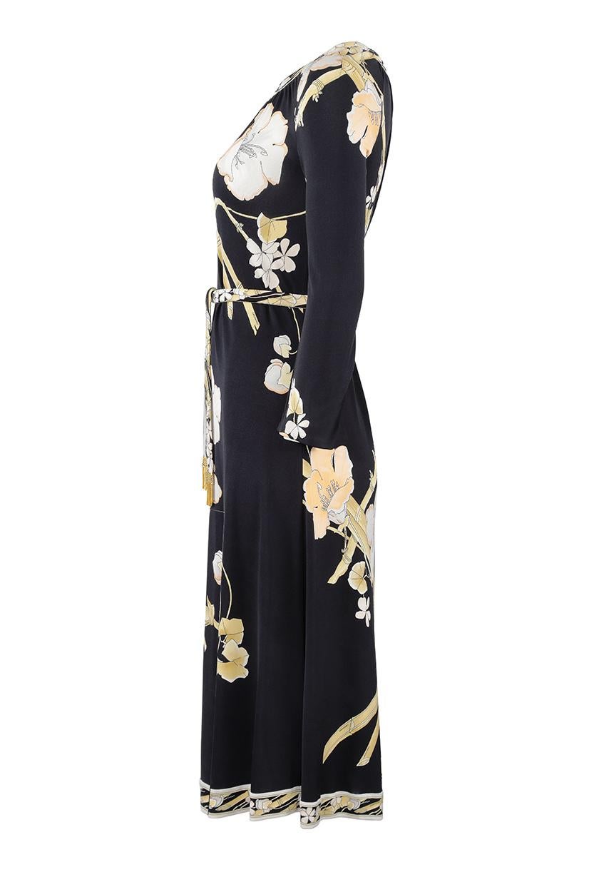 This sophisticated 1970s pure printed silk jersey dress is by French fashion house Leonard studios and is in impeccable vintage condition. The designer Daniel Tribouillard defined his aesthetic using printed silk fabrics, much akin to Pucci with