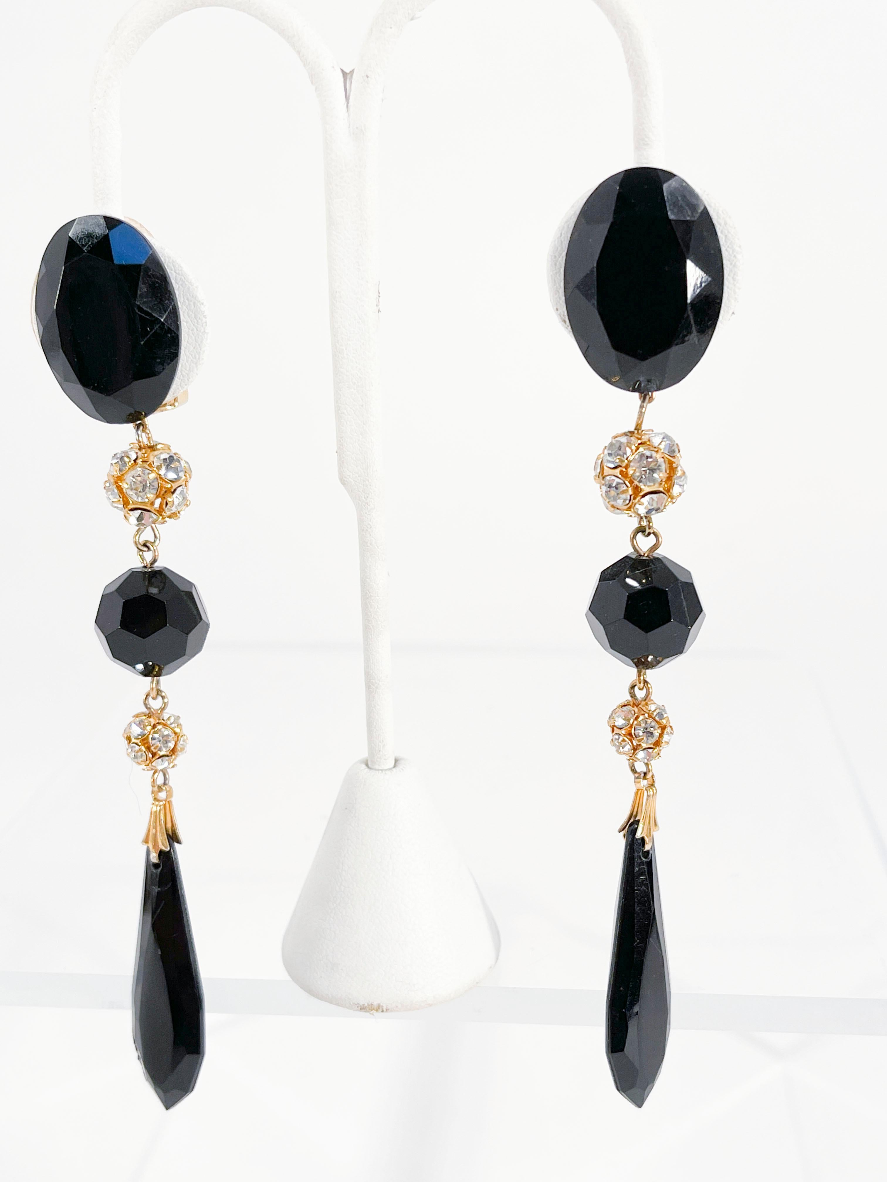 1970s Les Bernard Black multi-cut lucite extreme drop earrings decorated with clear rhinestone links.