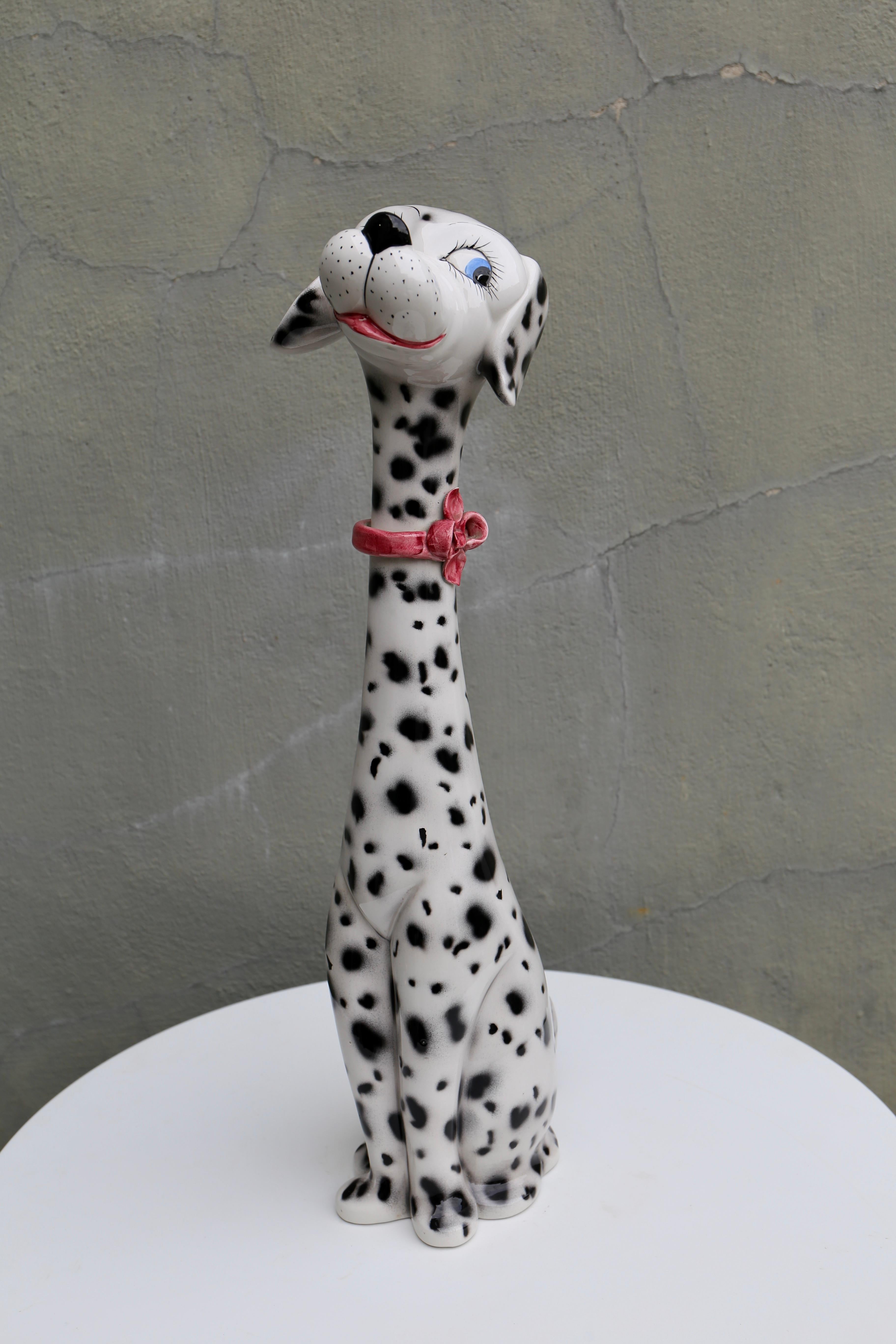 Vintage ceramic Dalmatian dog with cute red bow and adorable eyes, marked Italy on the base.

Height: 60 cm.
