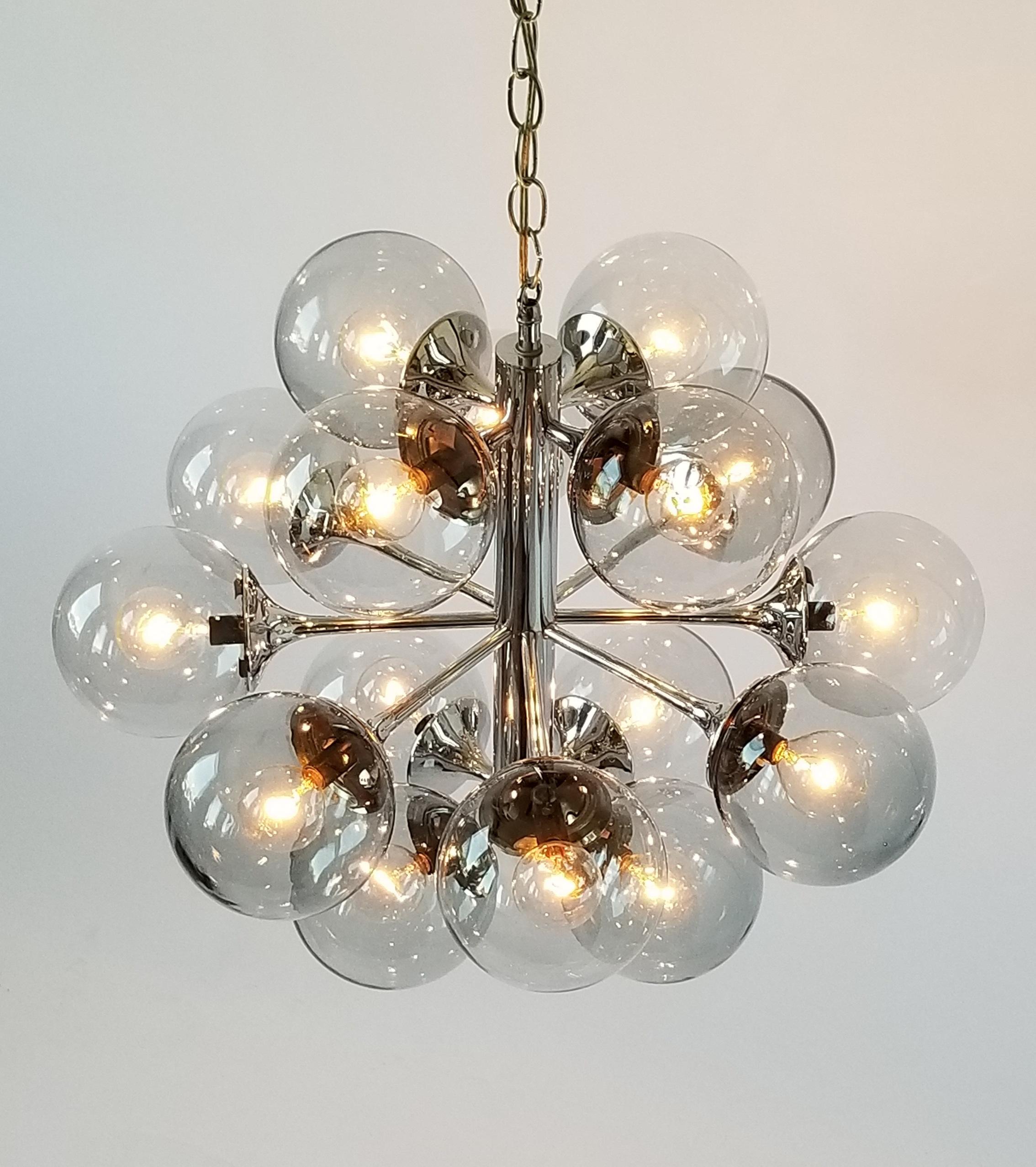 16 mouth blowed glass shade sitting on a deep chrome finish structure from Lightolier. 

Each shade measure 5 in. diameter. 

Solid, well made construction. 

Use 16 candelabra E12 size lightbulb rated at 40 watt max. 

Chain length is 22 inches for