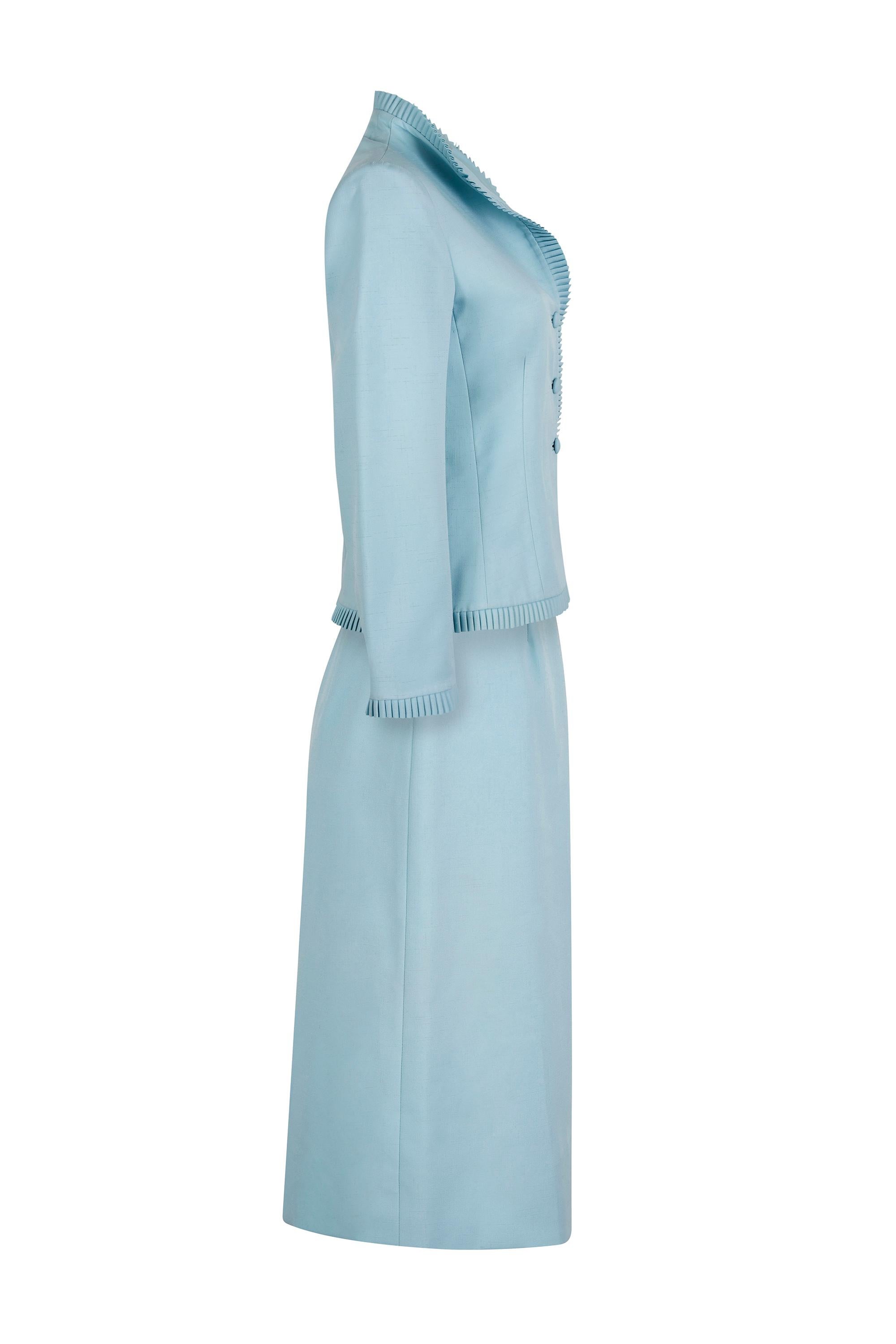 This lovely 1970s skirt suit in eggshell blue is by high end American apparel company Lilli Ann who's lines were celebrated for their beautiful, elaborately designed suits and coats. This beautiful ensemble is a perfect example of the quality and