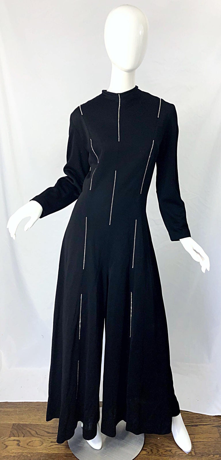 Amazing 1970s LILLIE RUBIN black knit rhinestone encrusted wide palazzo leg long sleeve jumpsuit ! Features lines of rhinestones up the front and back. Sleek tailored bodice with wide legs. Soft knit fabric offers plenty of stretch. Hidden zipper up