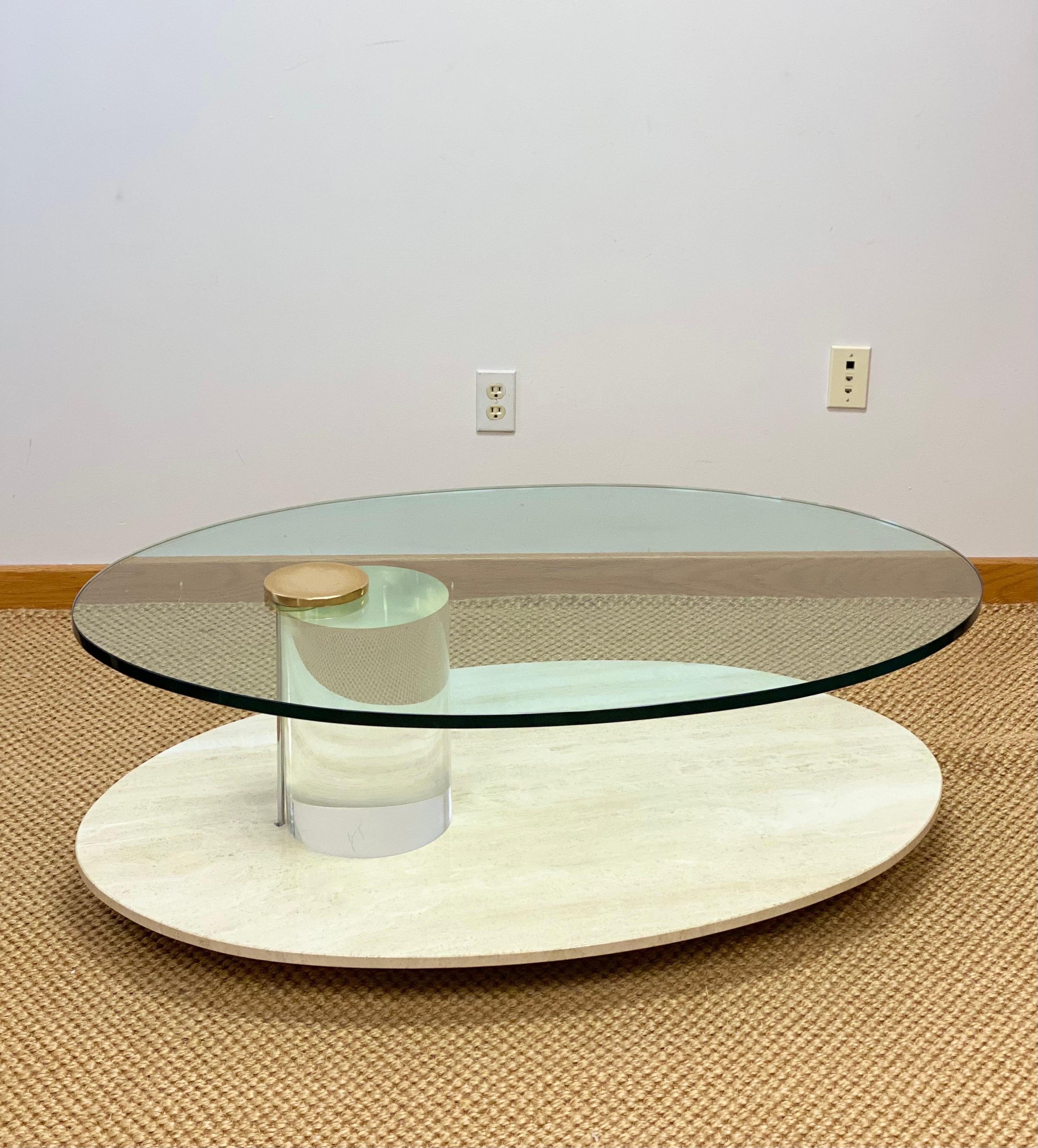 We are very pleased to offer a beautiful, sleek table by Lion in Frost circa the 1970s. Elegant in its simplicity and eye-catching in its execution, this piece is a dramatic anchor for the living space. A two-tiered, open oval construction stacks up