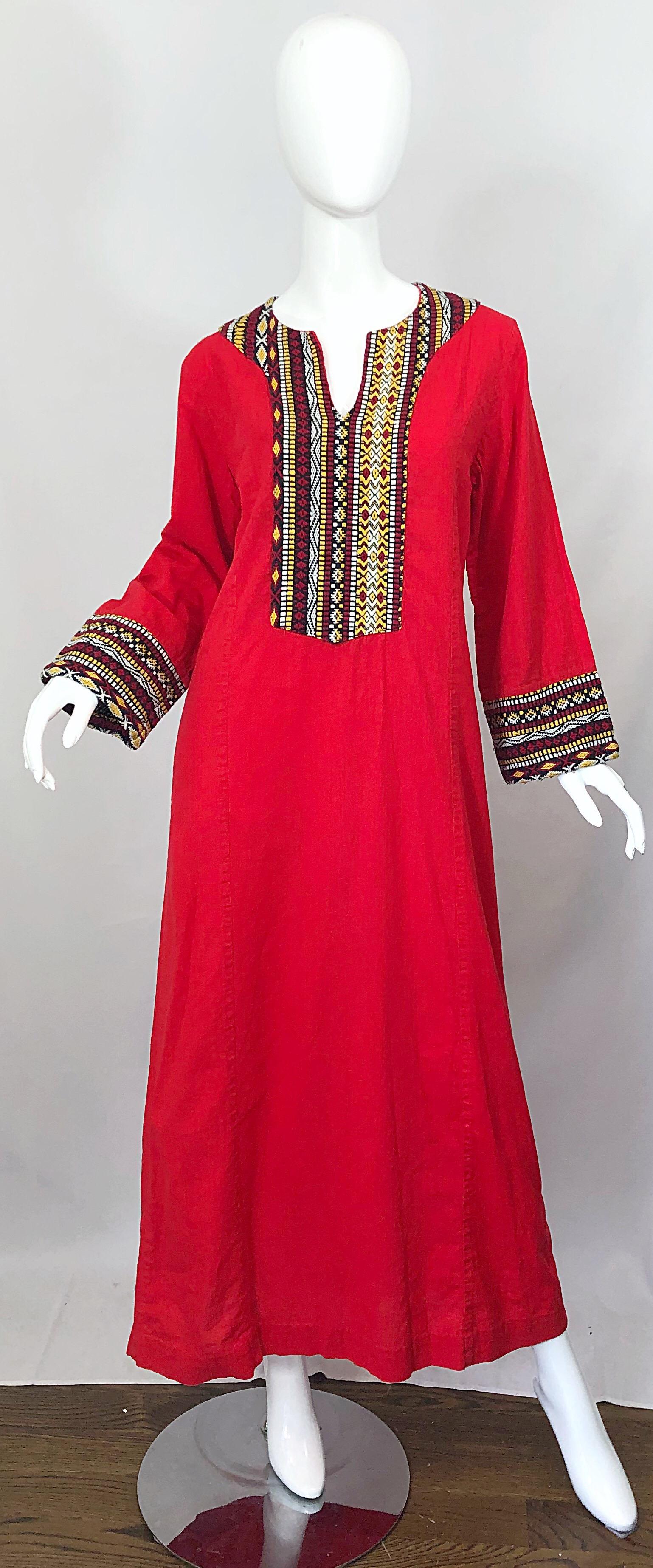 1970s lipstick red linen and cotton blend long bell sleeve caftan maxi dress! Features embroidery in red, yellow, black and white around the neck and sleeves. Simply slips over the head. Great for so many occasions. A very easy versatile piece to