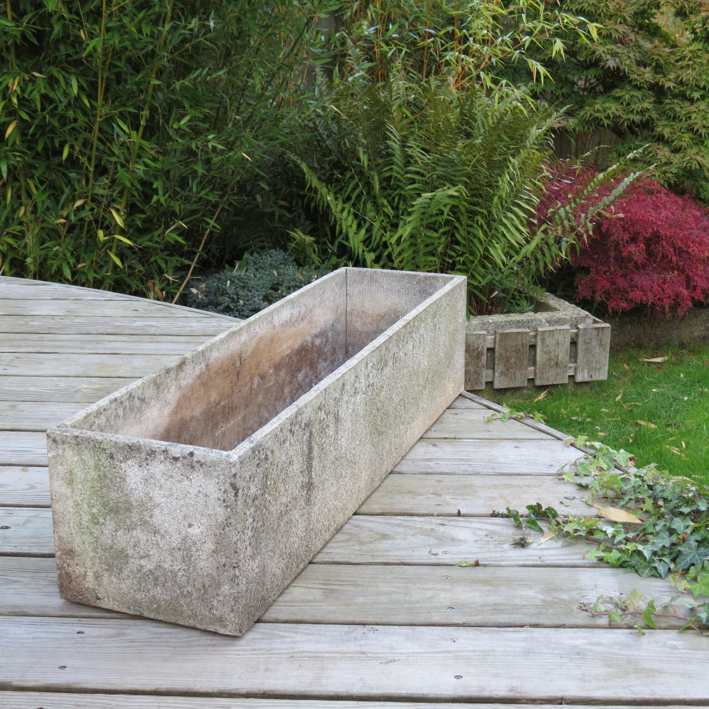 Wonderful long rectangular concrete garden planter, this were produced in the UK in the late 1960s early 1970s. Very well made, good quality fine planter. Good vintage condition, very nicely patinated all over. 
 
Matching smaller planter also