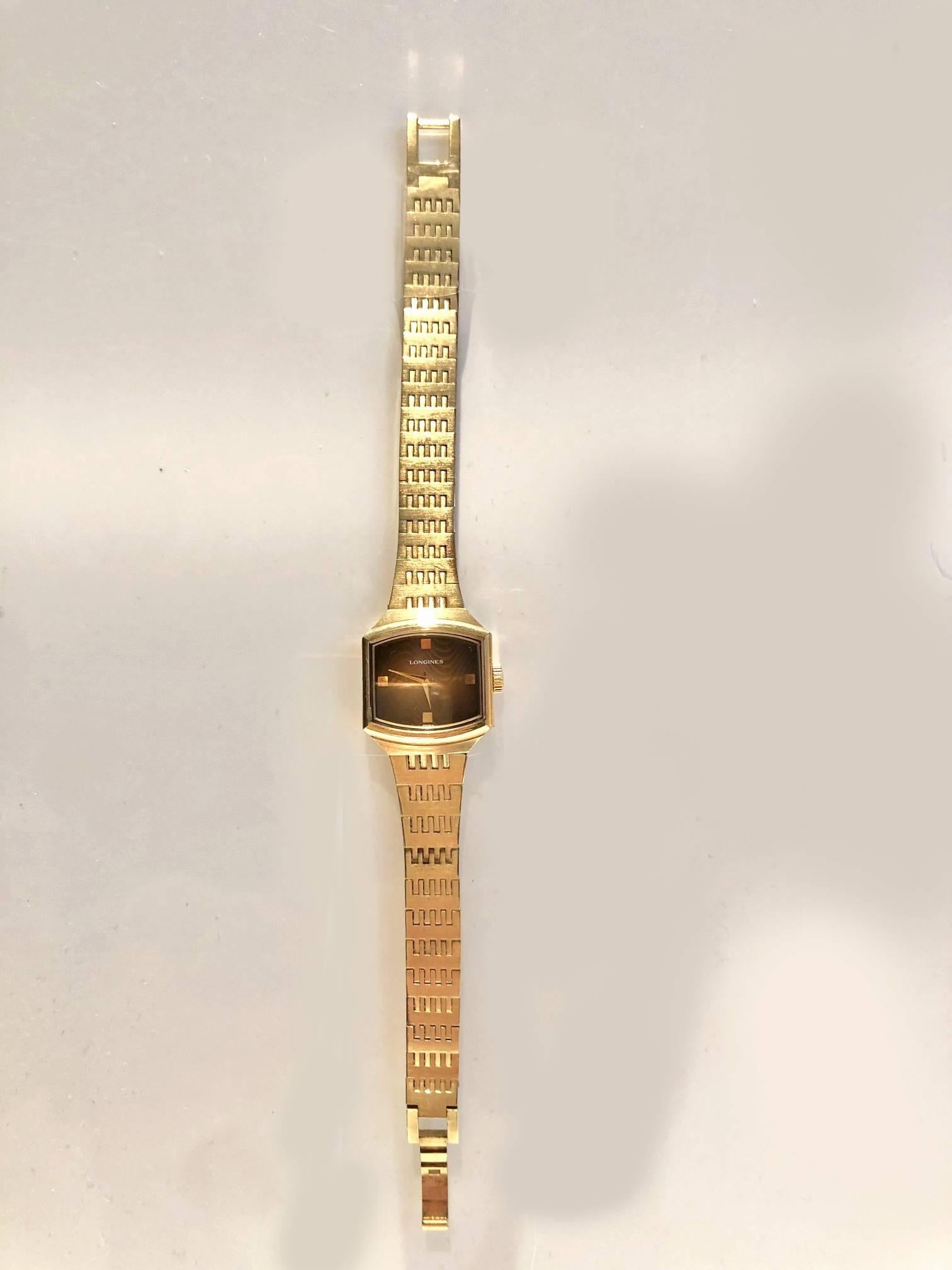 Longines Gold steel cal 15L 17 jewel wristwatch, mechanical movement, wave pattern on gold face,

Condition: 1970s, good working order, some colour fade on steel as expected, overall very good condition

Measurements: 
- face 2 x 1.5 cm 
- length: