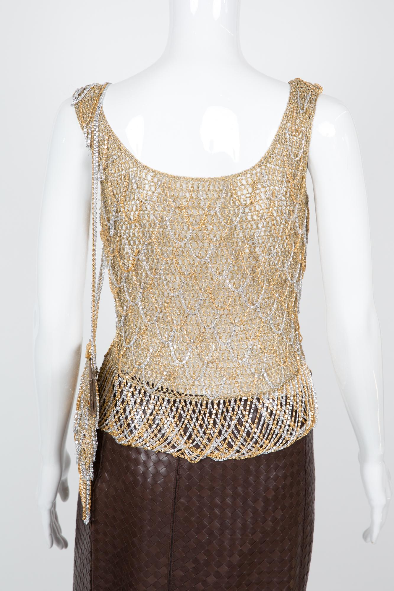  1973 Loris Azzaro metallic chainmail knitted set featuring two tone metallic top comes with matching chainmail shoulder bag.  Structured minaudiere frame featuring baroque ball clasp closing. Missing designer label on the top, you'll get it only