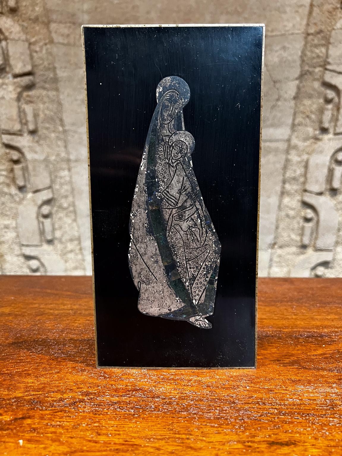 1970s Los Castillo Virgin Mary Silver Black Wall Art Taxco Mexico
Silver on Black Lacquered Wood
10.25 H x 5 W x .75 Thick
Made in Mexico.
Maker stamped.
Original vintage unrestored preowned fair condition.
Please refer to images.