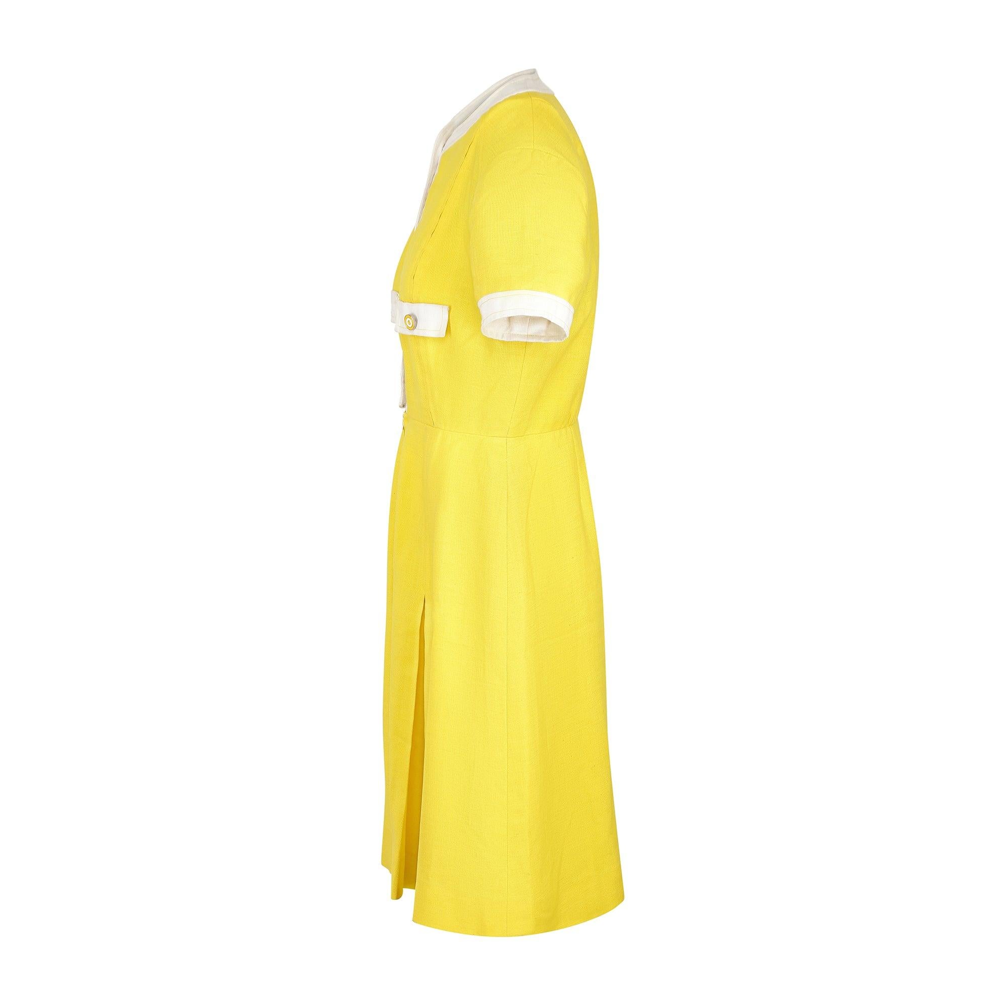 French fashion house Louis Féraud designed this dress for high-end British store Rembrandt during the late 1960s to early 1970s. Made in England, it is crafted from linen in a vibrant yellow hue. The dress celebrates Feraud’s eye-for-detail in its