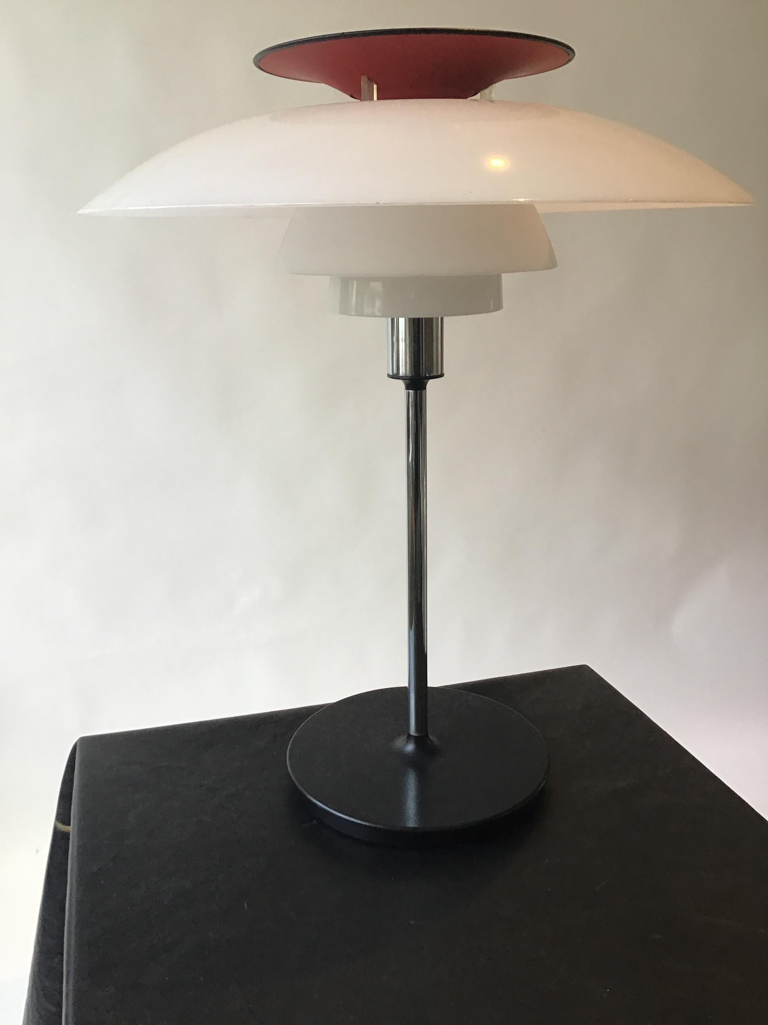 1970s Louis Poulsen red table lamp. Plastic and chrome plated.