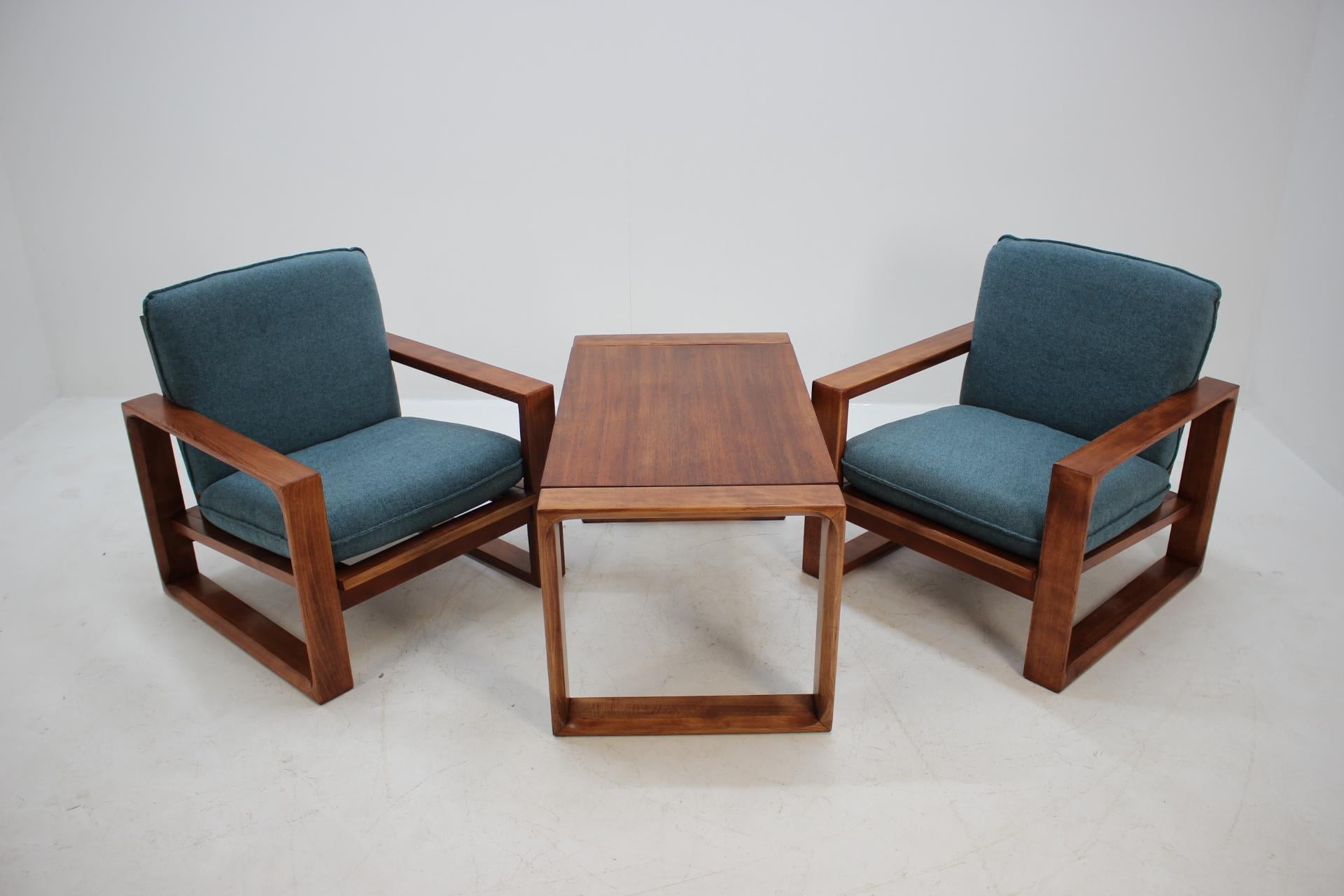 Made in Czechoslovakia. Set of two chairs and coffee table. Newly upholstered. Carefully refurbished. Dimensions of the coffee table height 50cm, width 90cm, depth 55cm.