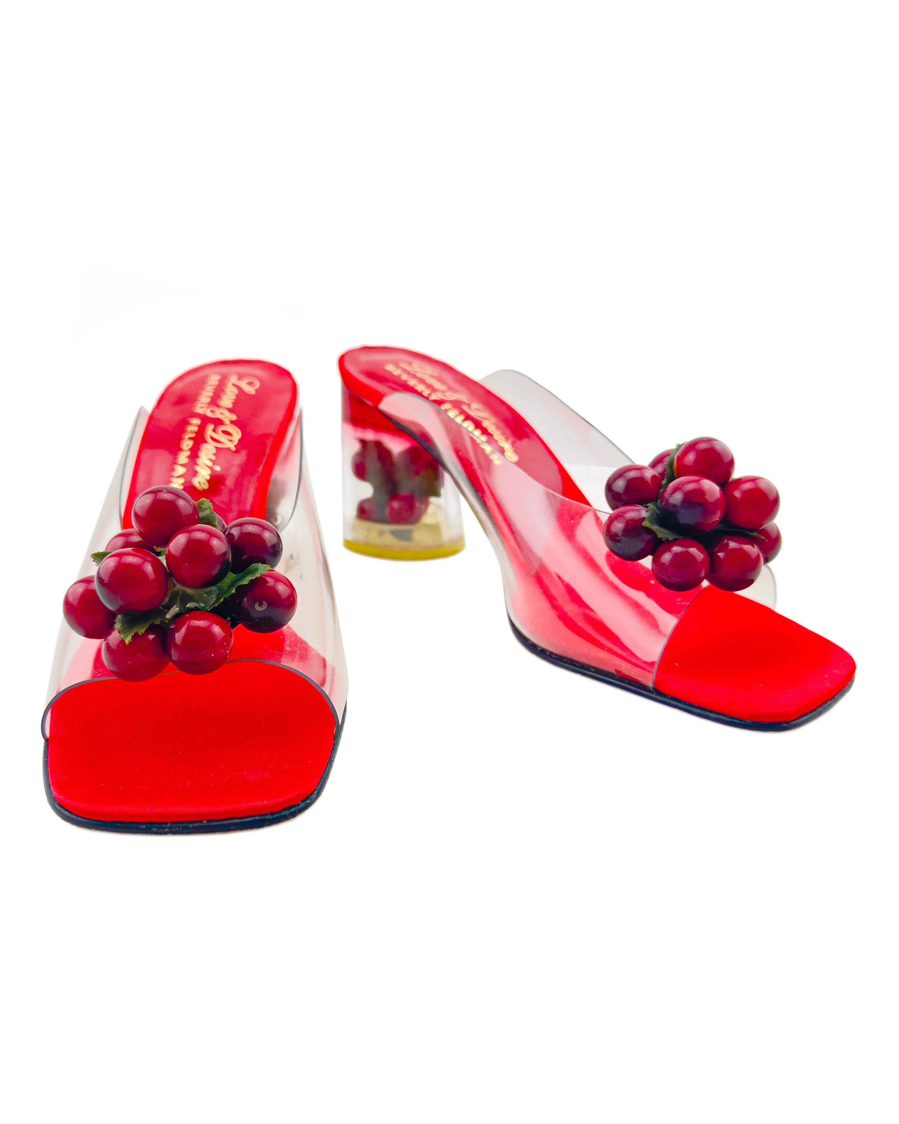Love & Desire by Beverly Feldman heeled mules from the 1970s. Clear PVC upper with a cluster of cherries, bright red leather and silk interior insole and clear acrylic block heel with another bunch of cherries inside. Rounded square toe. Excellent