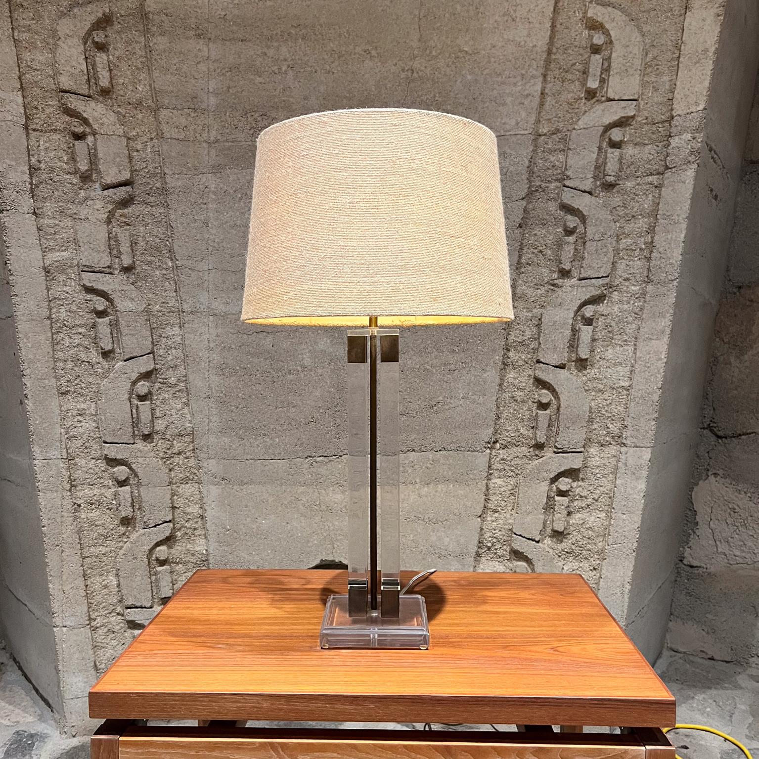 
1970s Modern Lucite Brass Table Lamp
Style of Charles Hollis Jones- Modern Hollywood Regency era.
Stunning form
Unmarked.
21.5 tall to socket x 6 d x 6 w
Preowned Original vintage unrestored condition. Shade is not included.
See images provided