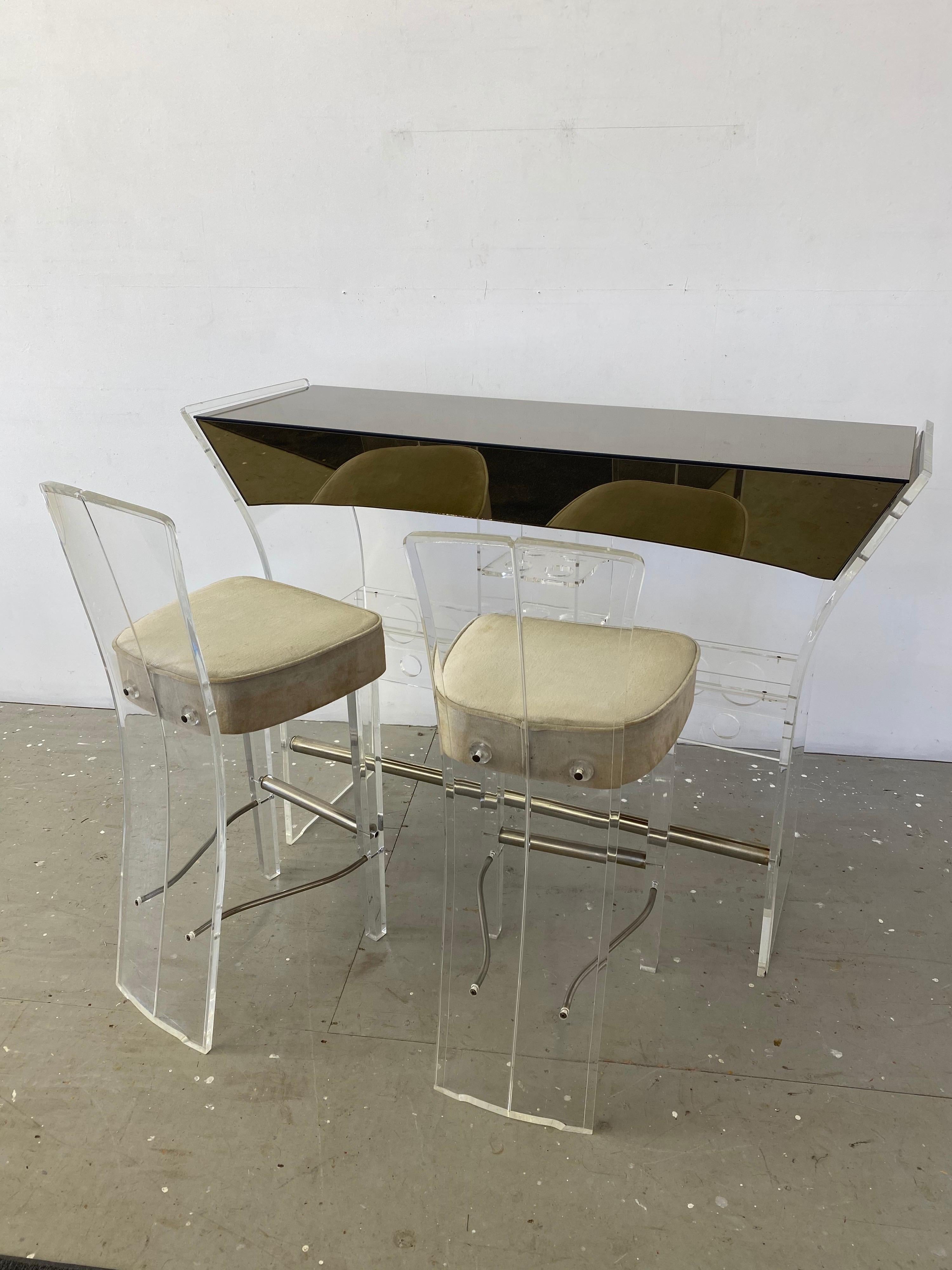 1970's Bar and 2 matching Bar Stools. Tons of storage below!  Lucite is very clean, Mirrors are  in great shape. Mirrors have a slight smokey gray cast to them. Bar stools are covered in the original velvet fabric, fabric shows wear and should be