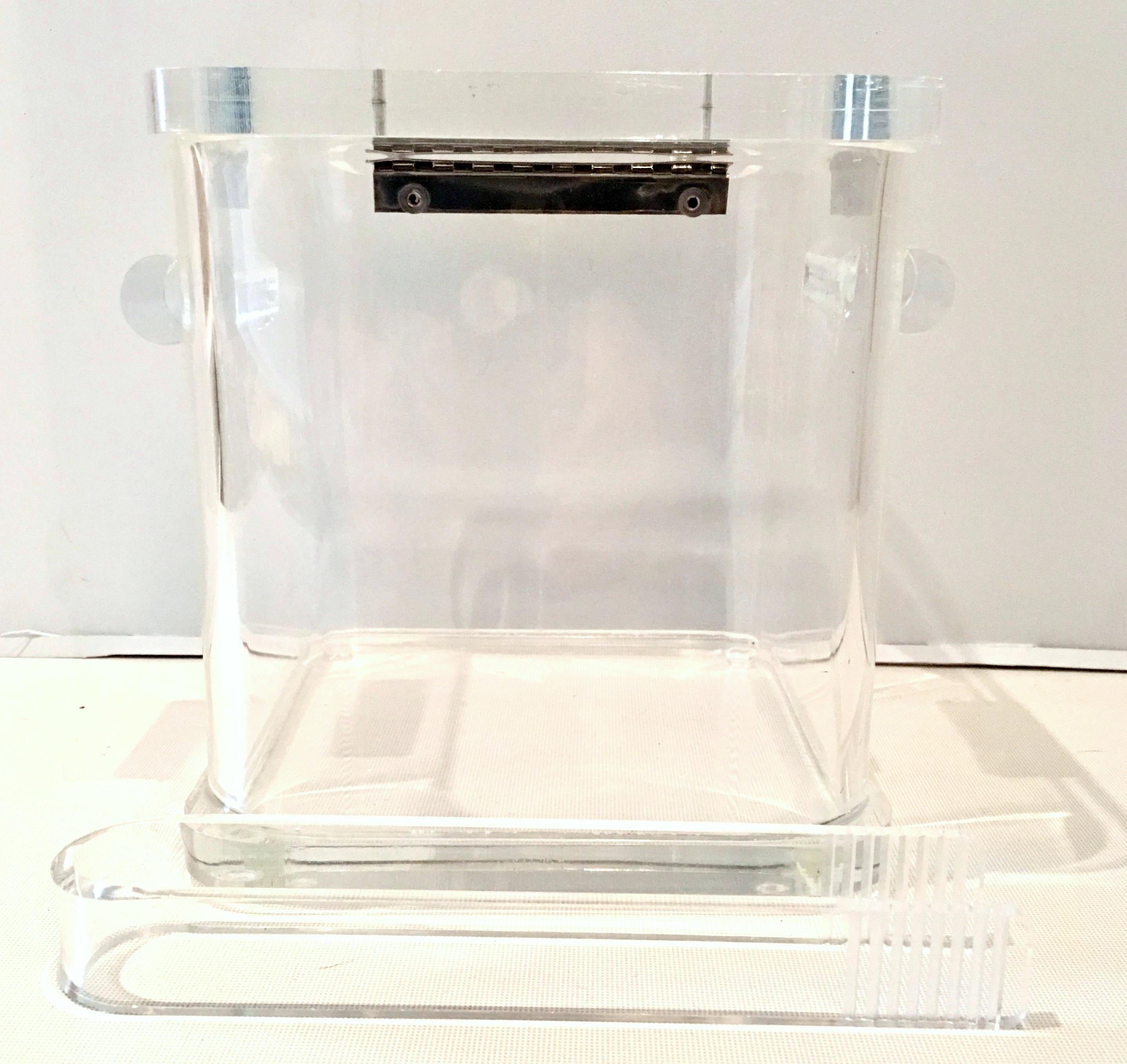 70's Substantial Lucite & Chrome Ice Box And Lucite tongs. Features chrome hardware hinged lid, faceted sides and tubular handles. Lucite lid is .50