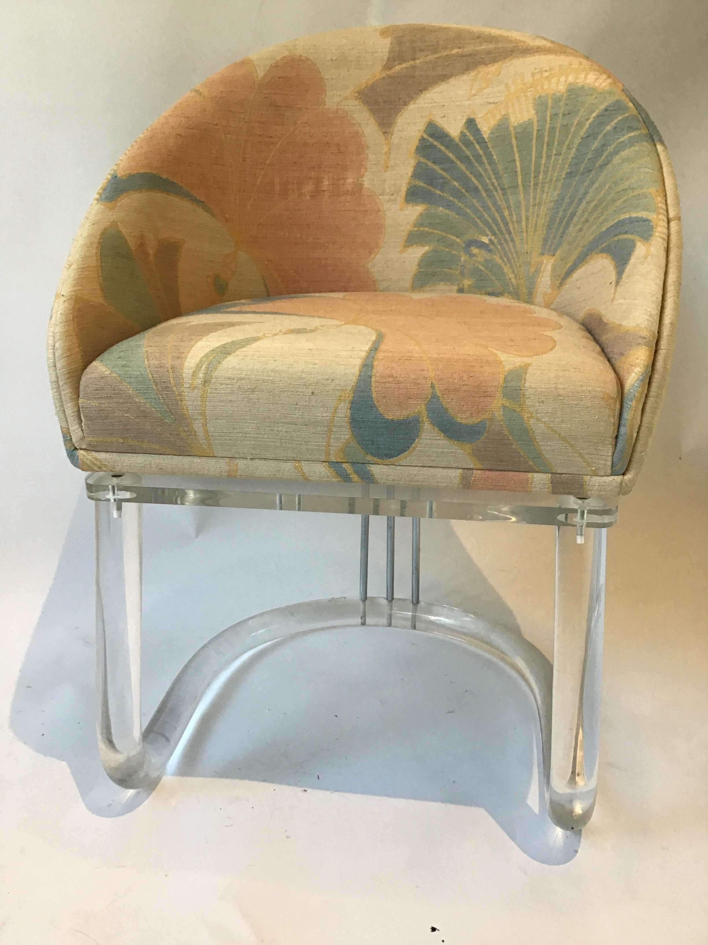 1970s Lucite swivel chair. Chrome rods. Original fabric.
This can be shipped through UPS.