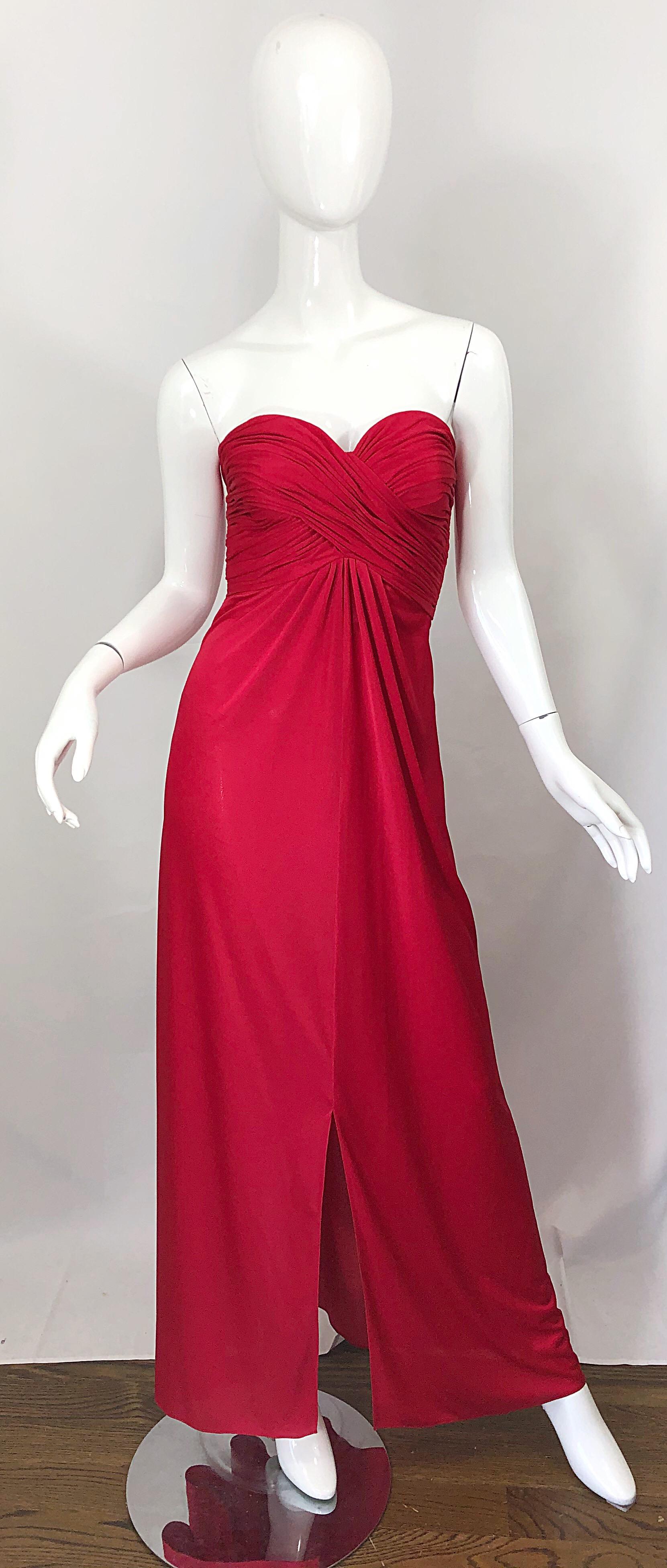 Beautiful mid 1970s LUIS ESTEVEZ lipstick red silk jersey strapless Grecian gown / maxi dress ! Features an intricate gathered boned bodice. Full metal zipper up the side with hook-and-eye closure. Slit up the center hem. Couture quality, with so