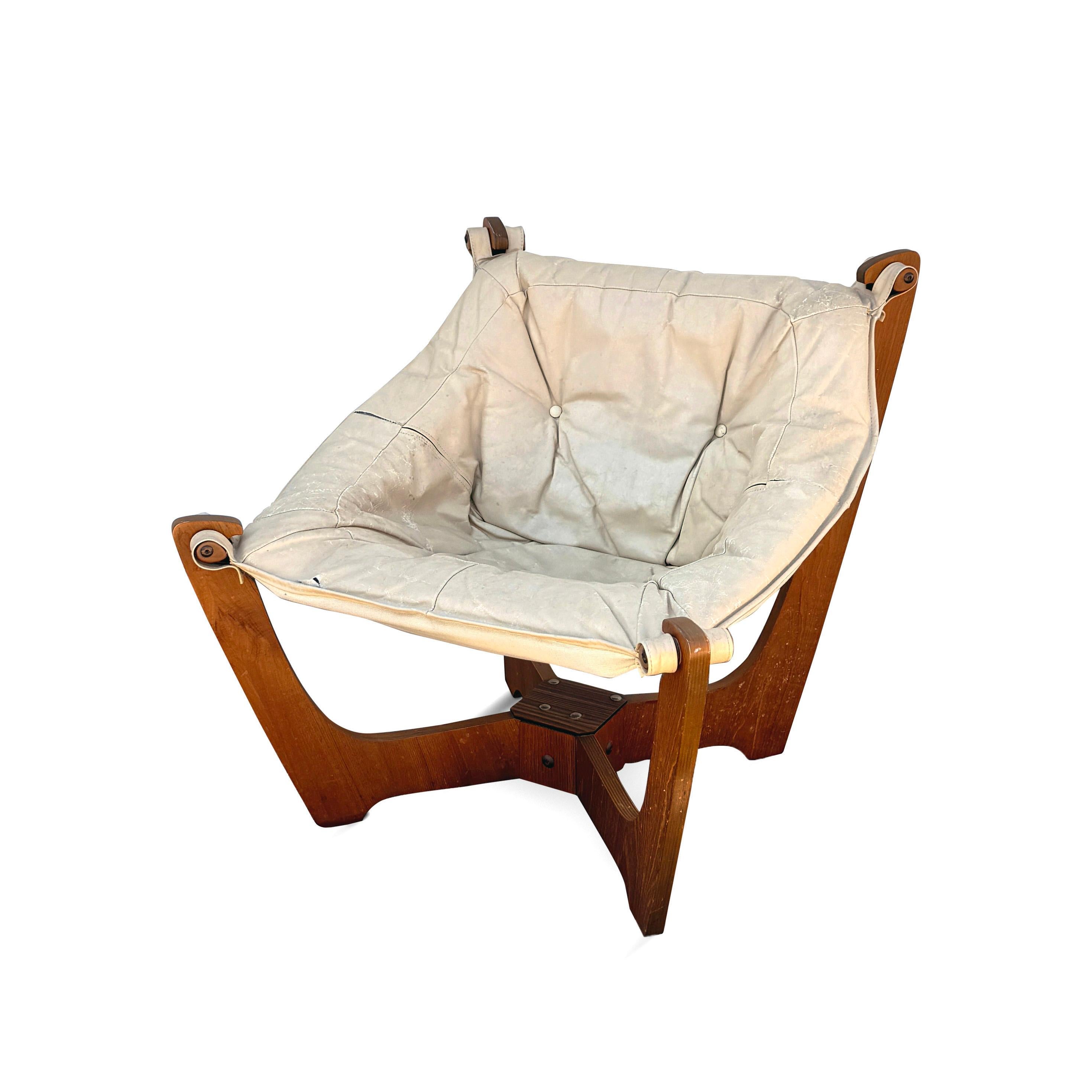 A classic of Scandinavian Design, the Luna chair was designed by Odd Knutsen (1916-1986) for Hjellegjerde Møbler in Norway, circa 1970s.  Comfortable, sleek, and stylish, this chair’s design features a leather sling seat suspended from a criss-cross