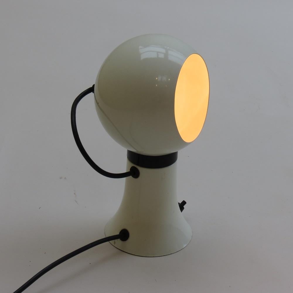 Wonderful vintage spot desk lamp, by The Modern Lighting Company. The lamp dates from the 1970s and is good working order. The top of the lamp containing the bulb magnetises to the base, allowing the shade to be easily adjusted to direct the light.