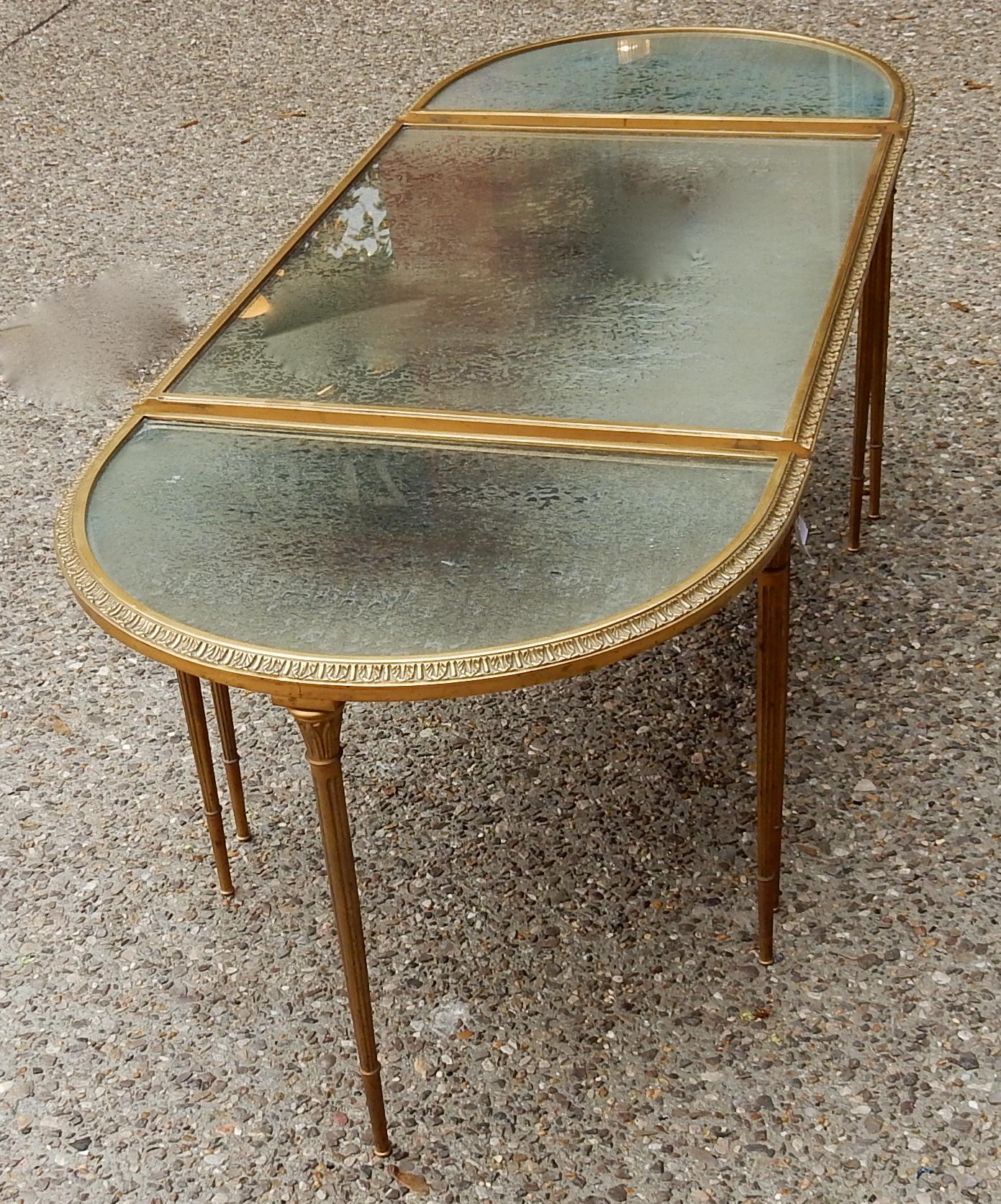 1970s in the style of Maison Charles or Maison Jansen or Maison bagués golden brass tripartite table, with olded mirror trays, .
Everything is demountable and screwed
Good condition.
Not signed
Measures: Middle table width 60 cm
Half-moon depth