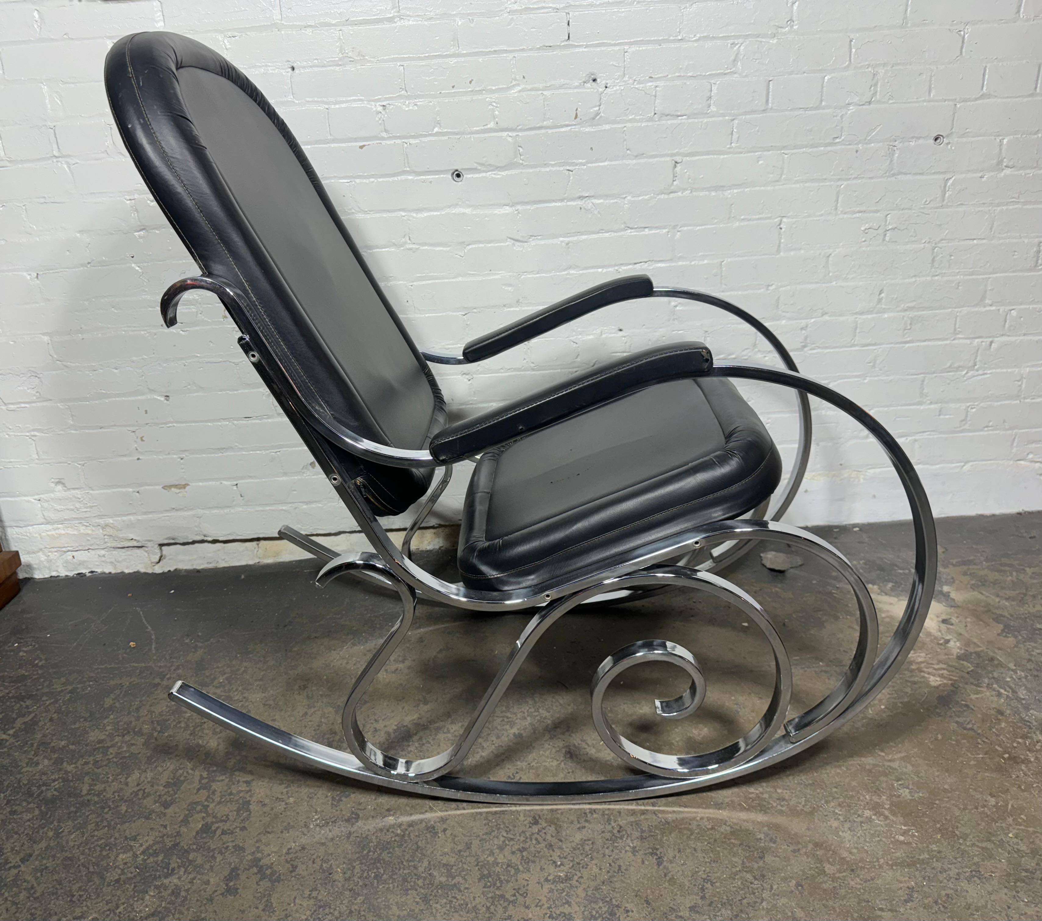 Vintage Mid-Century Modern rocking chair for sale. Designed by Maison Jansen in the 1970's.Classic design.similar to bentwood rockers made by Thonet. / but in chrome. The chrome frame is in nice original condition., original black naugahyde shows