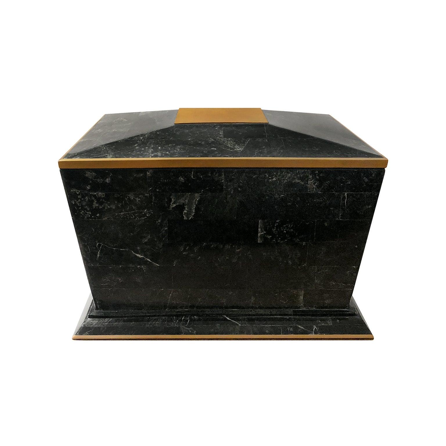 Maitland Smith black tessellated stone box with flares base and brass trim, USA, 1970s.
 