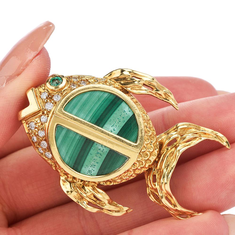 Matted Green and dazzling Diamond & platinum brooch characterize this nature-inspired “Fish on the hook” Unique pendant and Pin Brooch.

This  vintage 1970's piece is Crafted in 18.8 Grams of solid 18K yellow gold, featuring round-cut Vibrant
