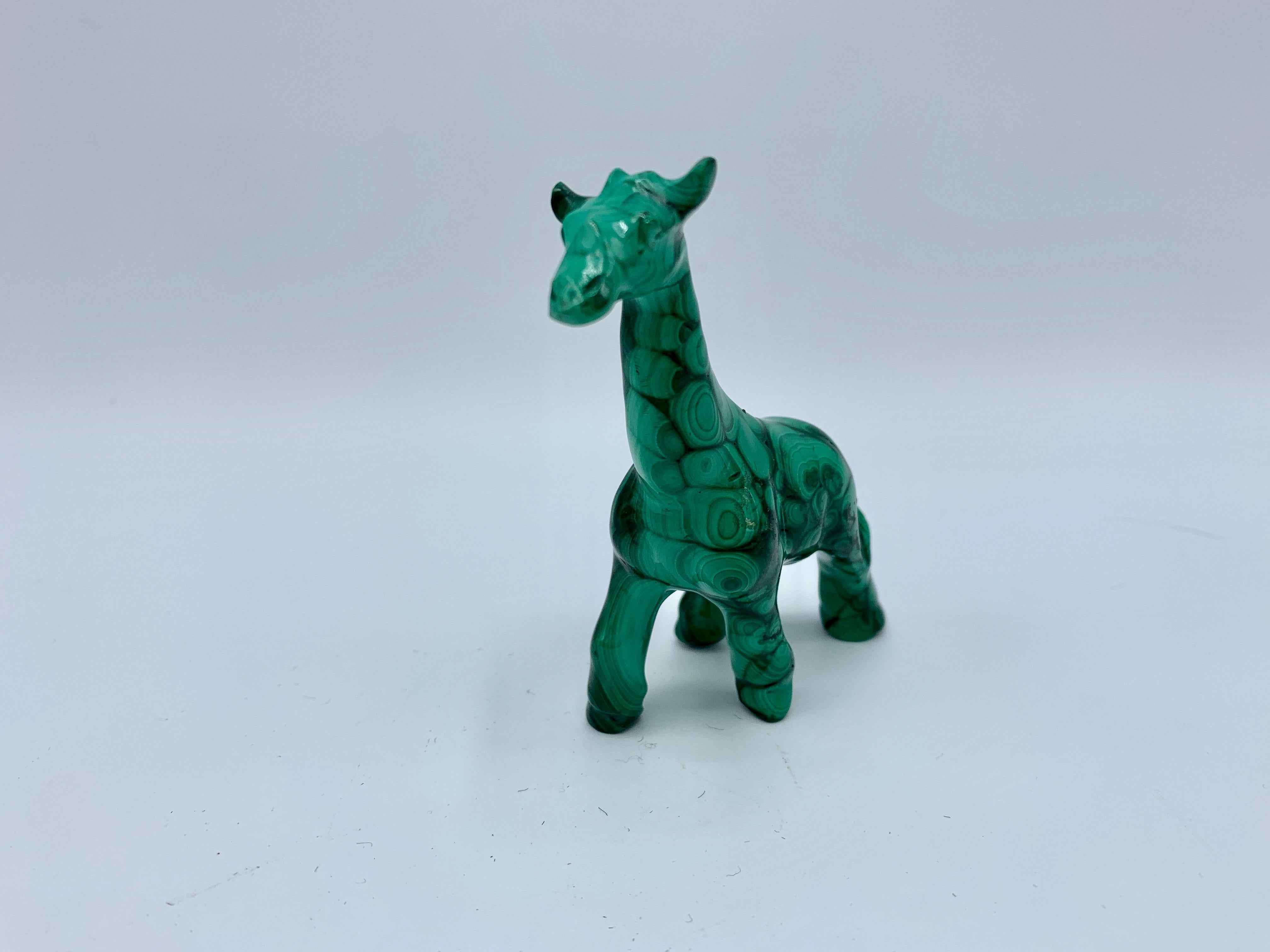 Offered is a gorgeous, 1970s solid-malachite giraffe sculpture. This stunning piece stands 3.25in tall and is in formed in a walking position.