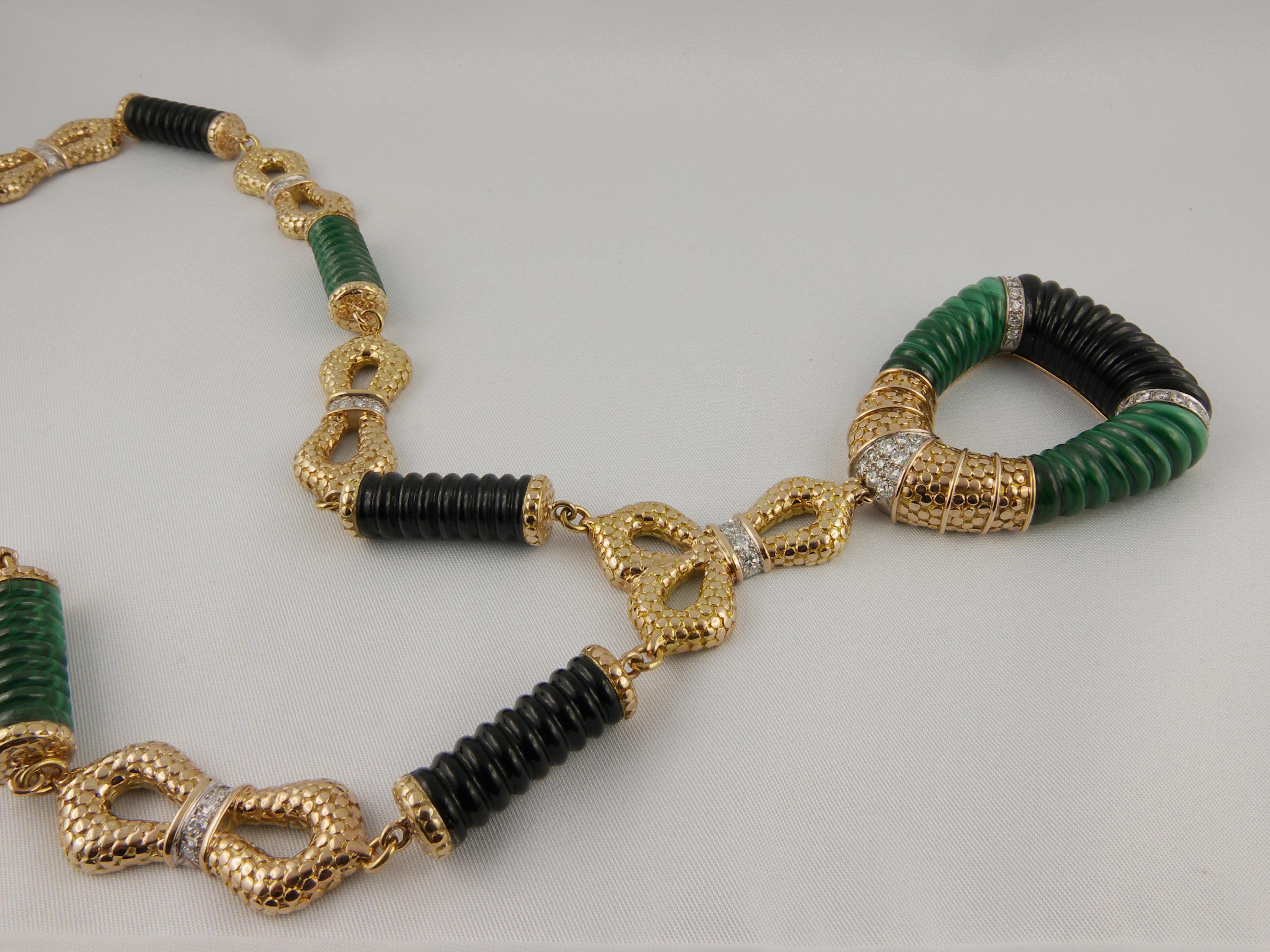 This stylish and glamourous 1970s Necklace is finely crafted in Yellow Gold  with a bold and geometric design that makes it chic and fashionable
Textured  Yellow Gold links highlighted with 2 cts strips of Diamonds are spaced with a series of ribbed